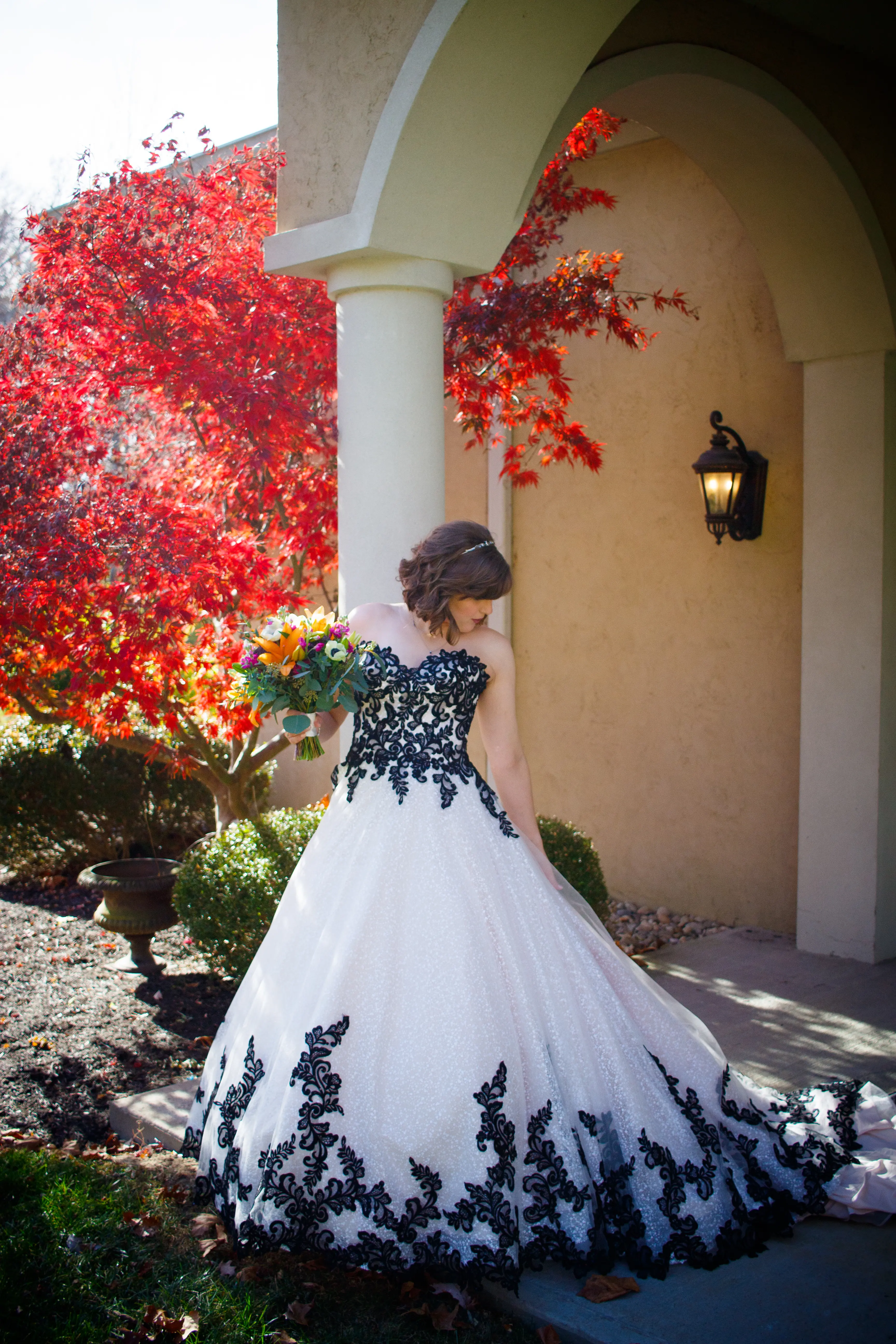 Bride Wearing Black And White Lace Strapless Ball Gown Called Tristyn By Maggie Sottero