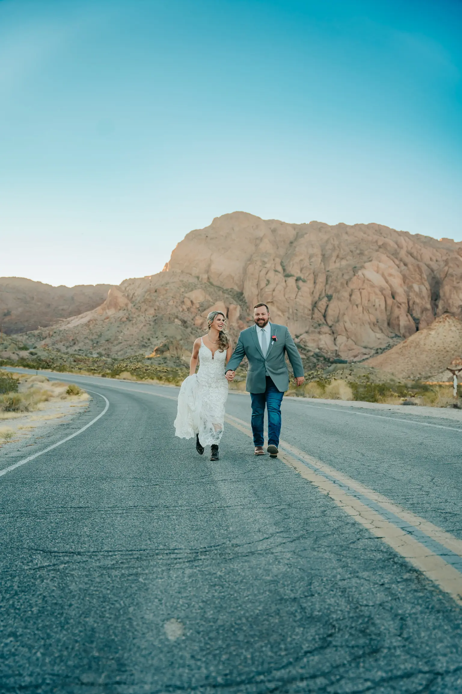 Groom with Bride in Sexy Low-Back Mermaid Wedding Dress with Beaded Lace Motifs over Sequin Chantilly Lace Calle Esther by Maggie Sottero
