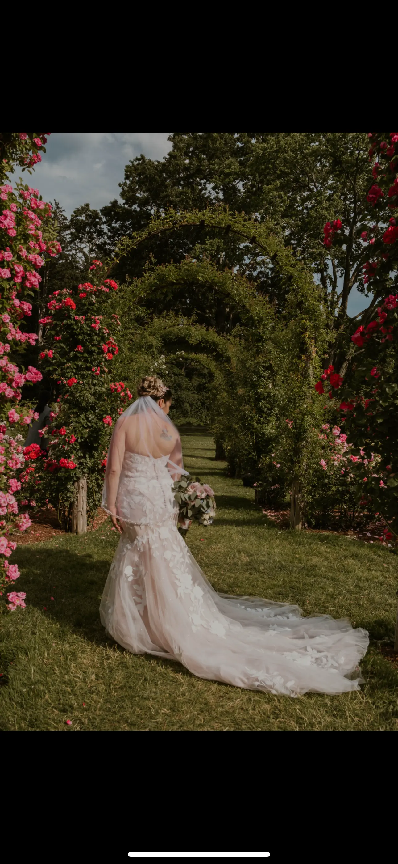 Bride In A Garden Wearing A Mermaid Lace Wedding Dress Named Hattie By Rebecca Ingram