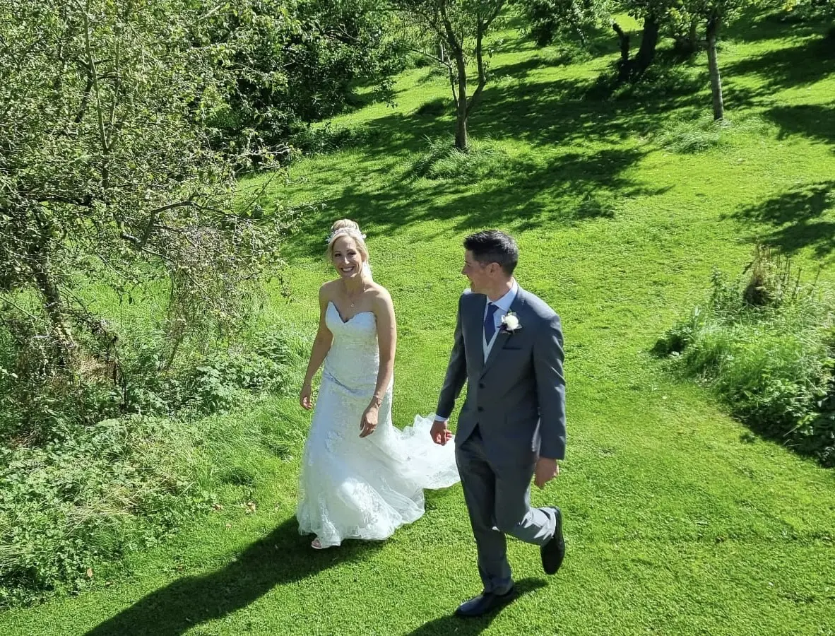 Bride wearing Helen by Rebecca Ingram with her husband