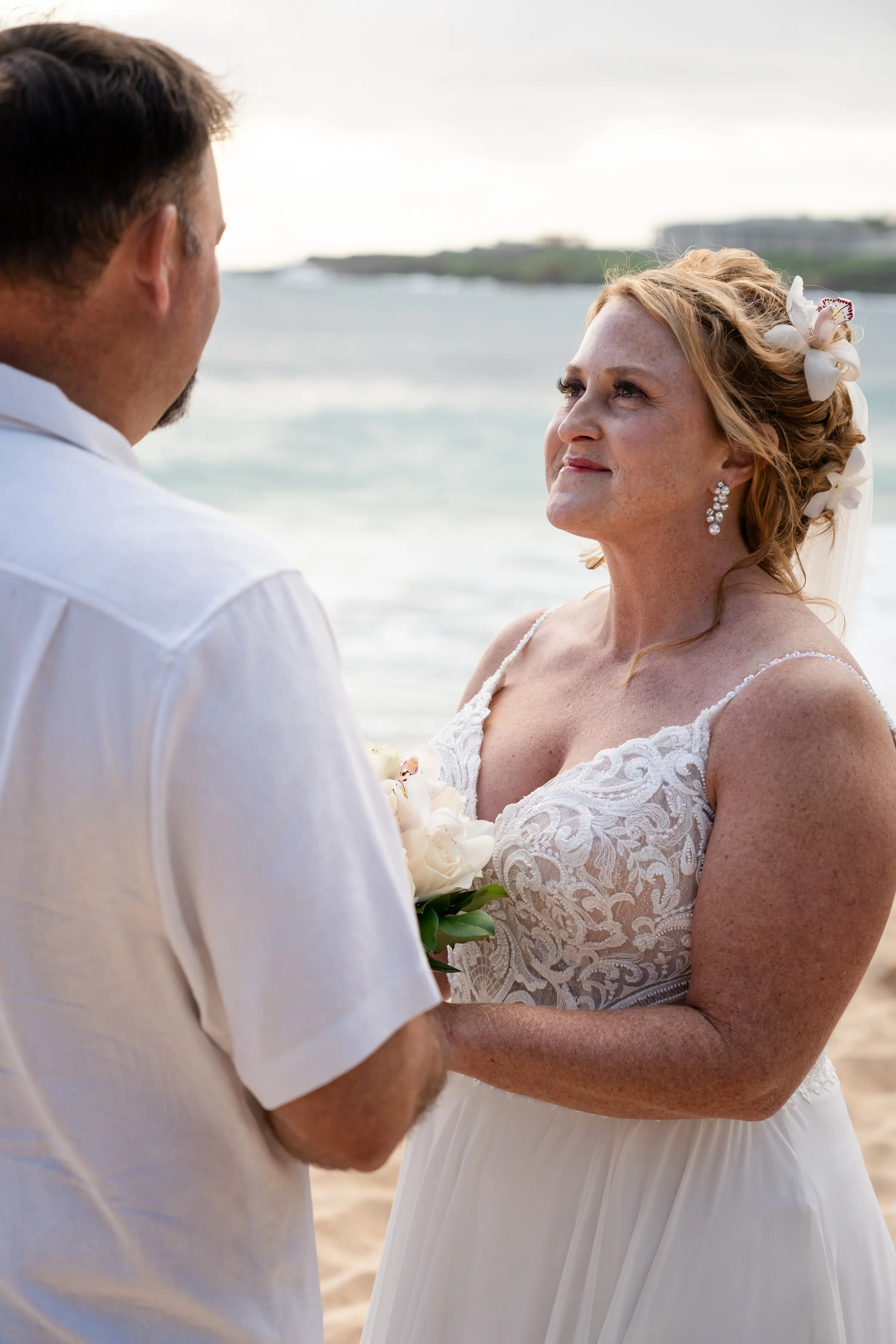 Bride wearing Lorraine wedding dress by Rebecca Ingram looking at her husband