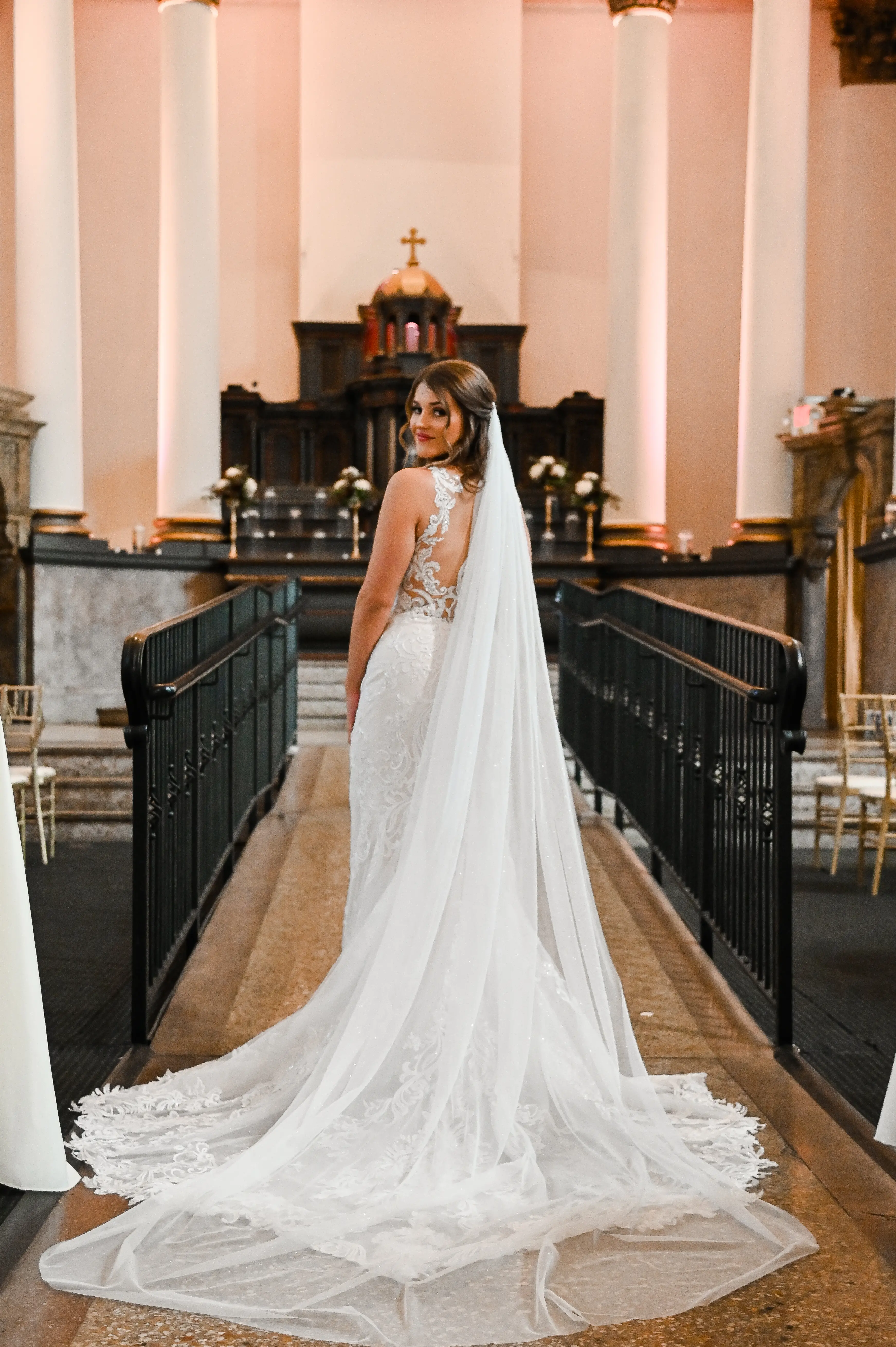 Bride wearing Hamilton wedding dress by Sottero and Midgley inside a church