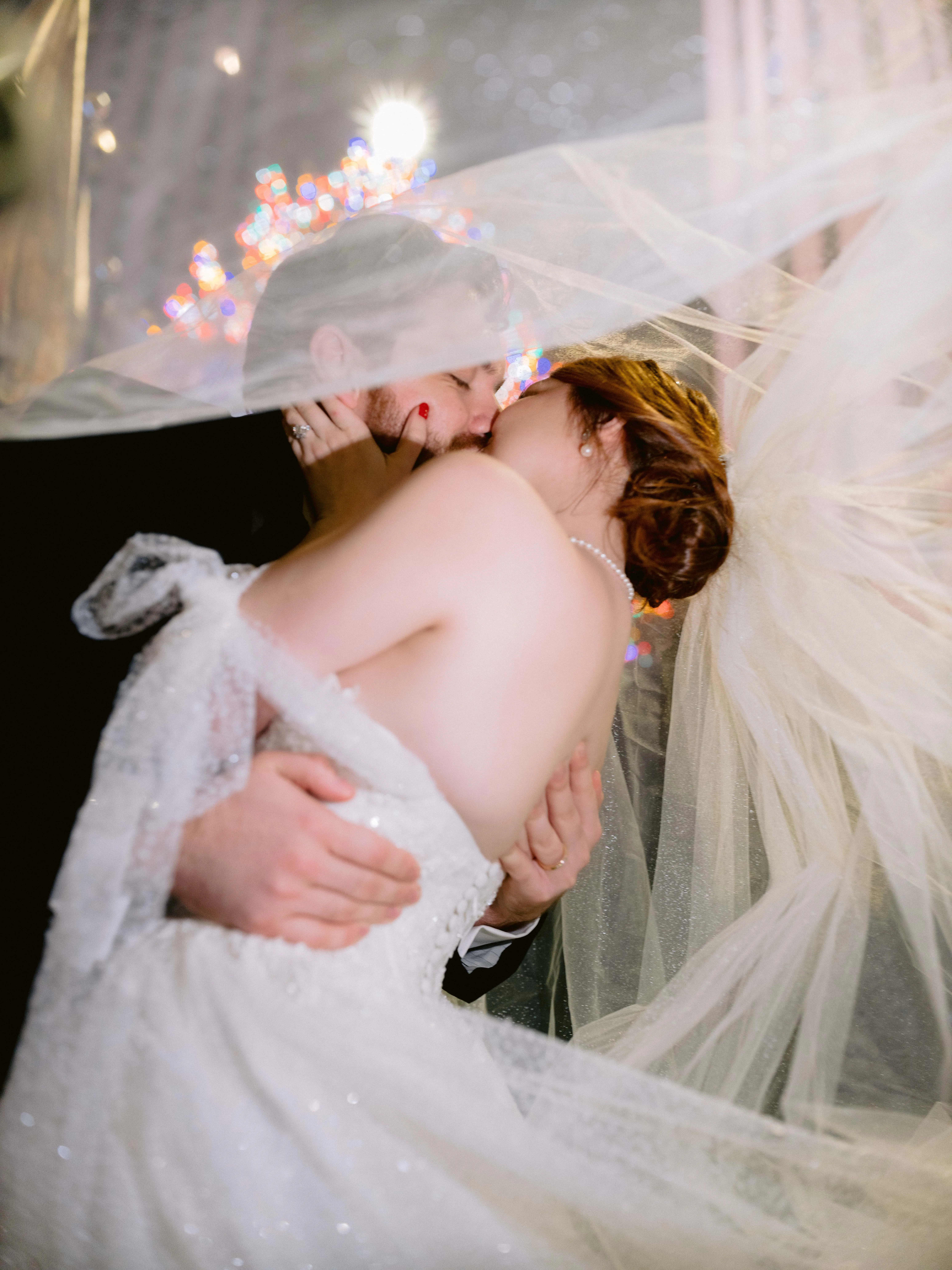 Bride Wearing Princess Ballgown Wedding Dress called Shasta by Sottero and Midgley Kissing Groom