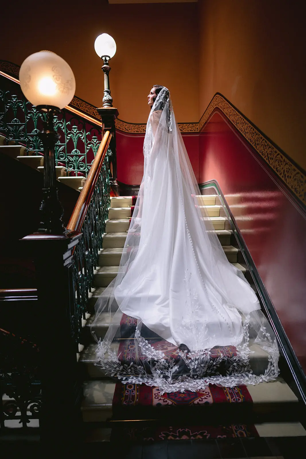 Bride wearing Aspen by Sottero and Midgley walking up the stairs