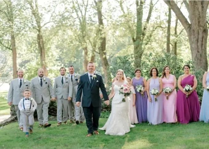 Family and Bride Wearing a Classic Lace Wedding Dress Called Brenda by Rebecca Ingram