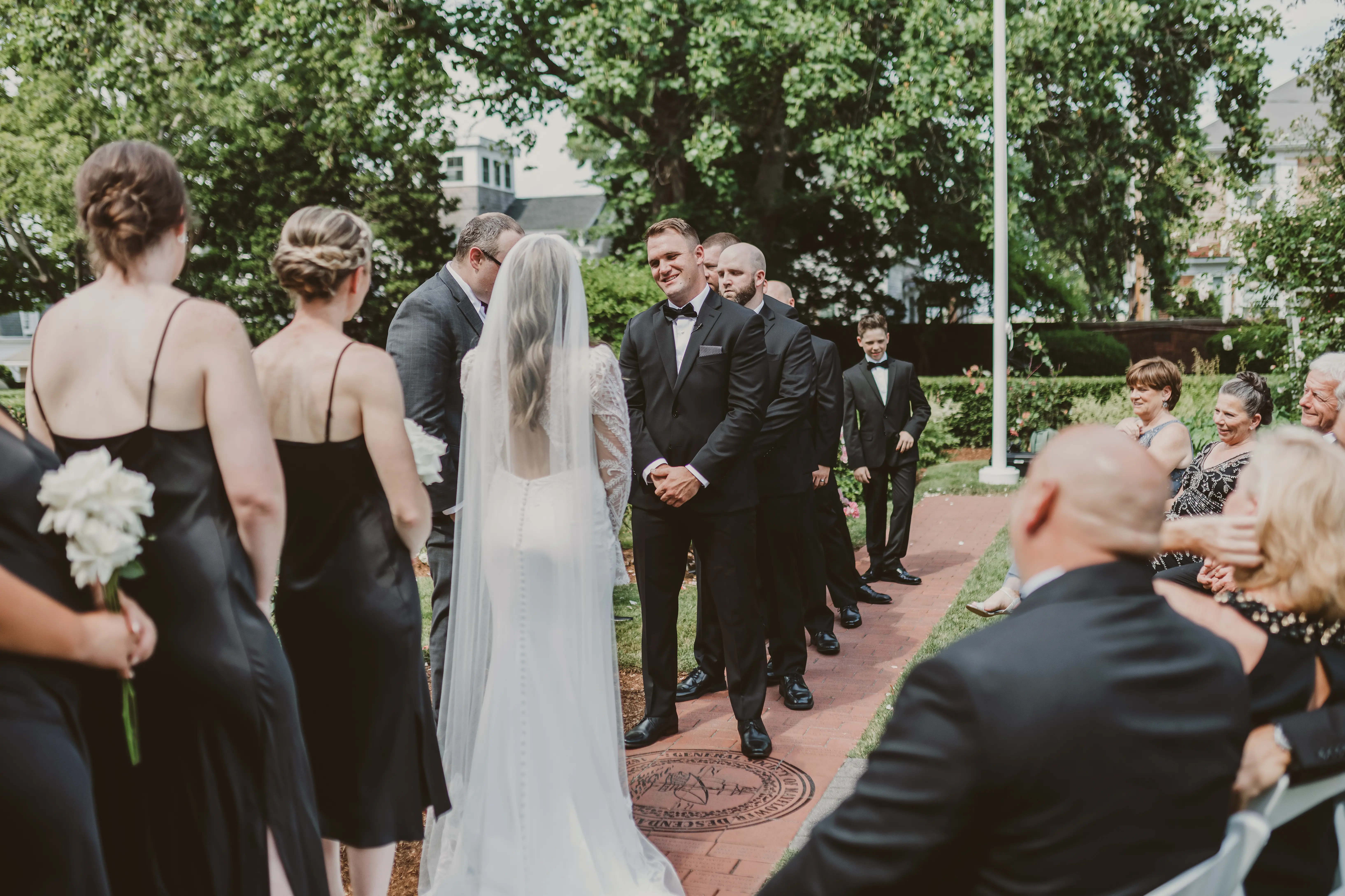 Groom looking sweetly at his bride at the altar.