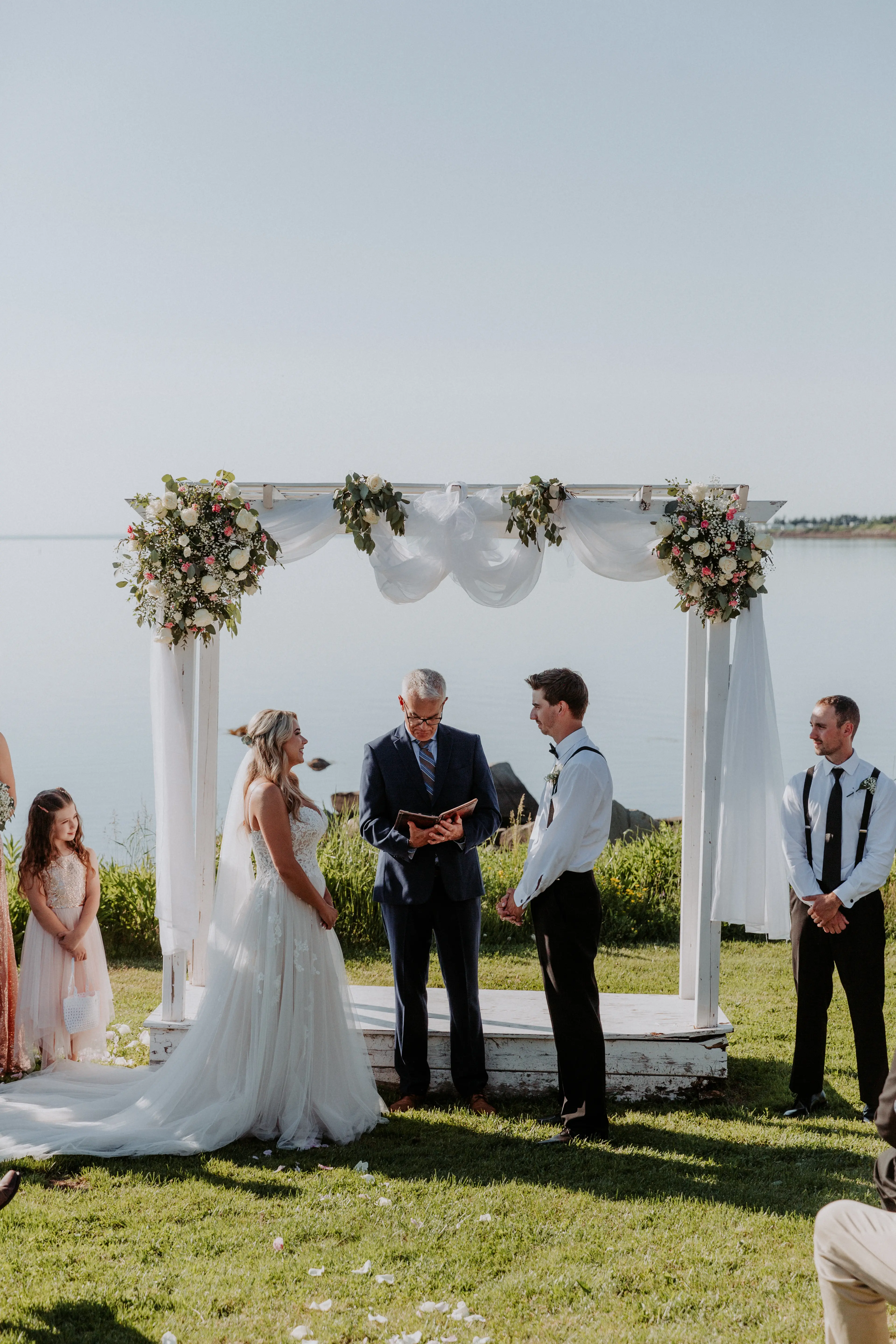 Groom with Bride in Flattering A-Line Spaghetti Strap Wedding Dress with Romantic Lace Called Marisol by Rebecca Ingram