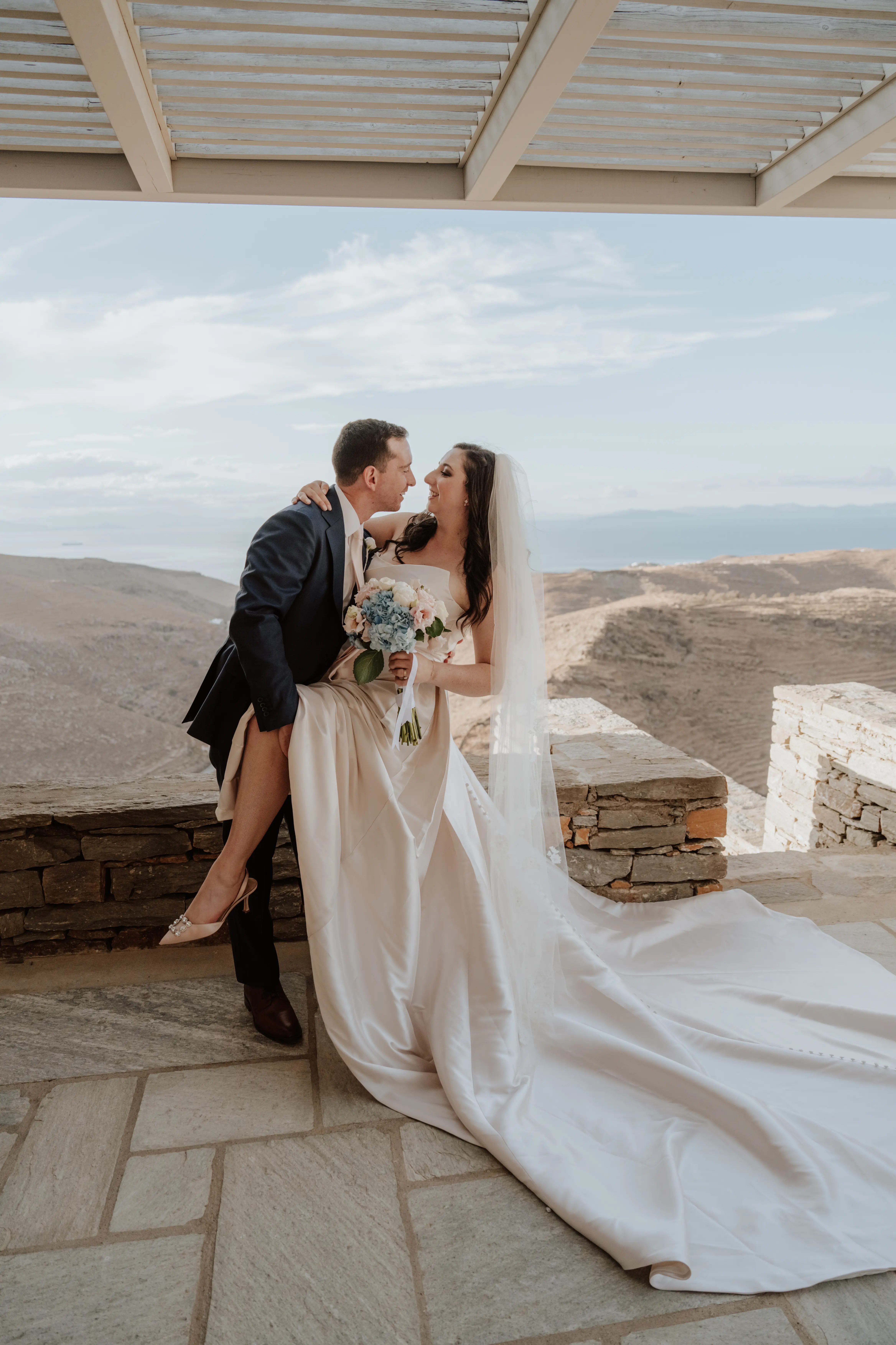 Bride wearing Aspen by Sottero and Midgley being dipped by her husband