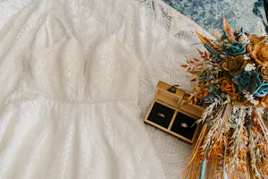 Rings and Bouquet on All Over Sequin Lace Wedding Dress called Roxanne by Sottero & Midgley