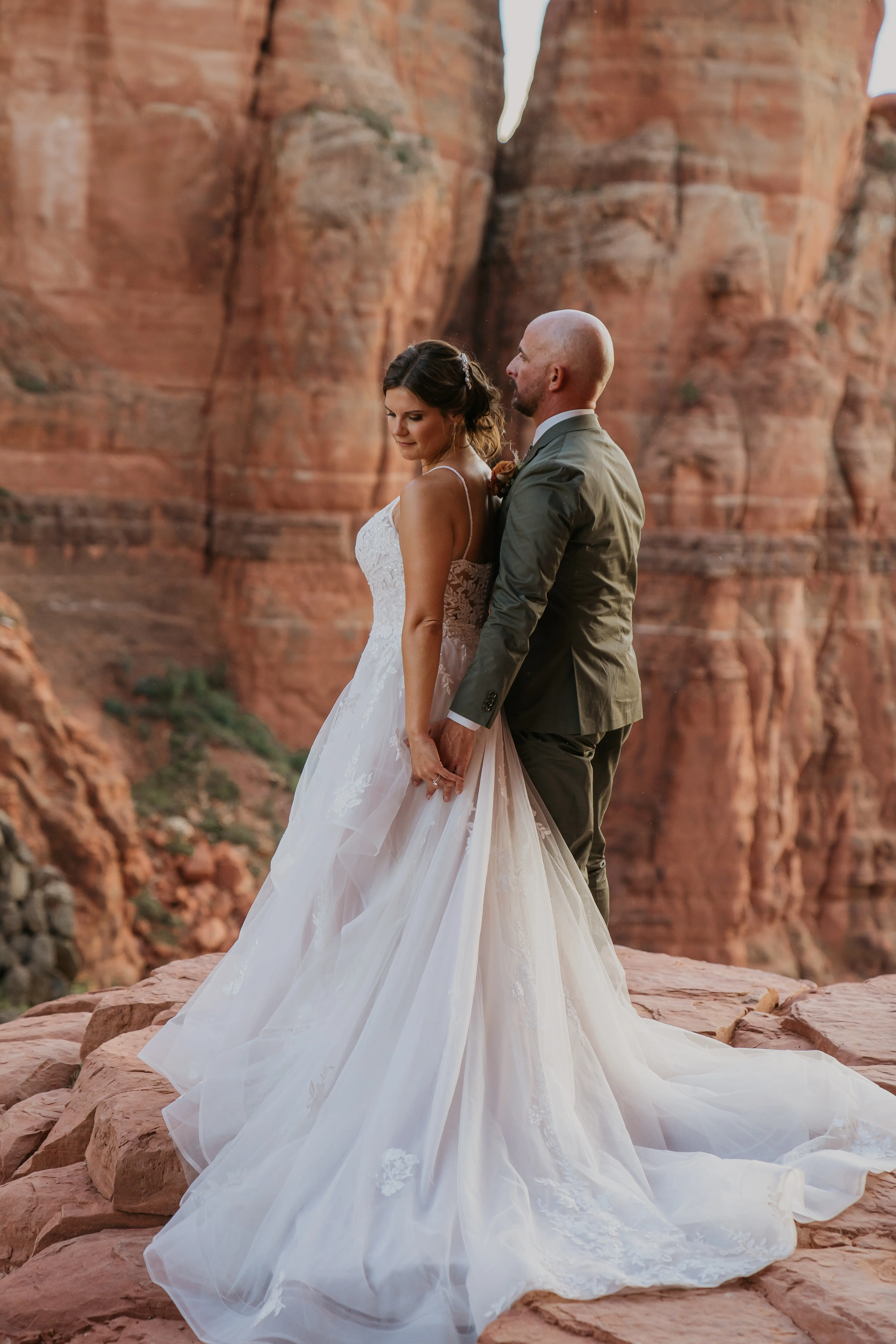 Groom Holding Bride In Floral Tulle Wedding Dress Named Lettie By Rebecca Ingram