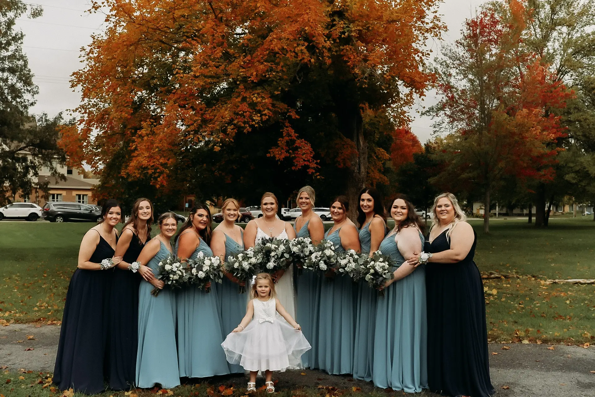 Bride wearing Pia wedding dress by Maggie Sottero with bridesmaids