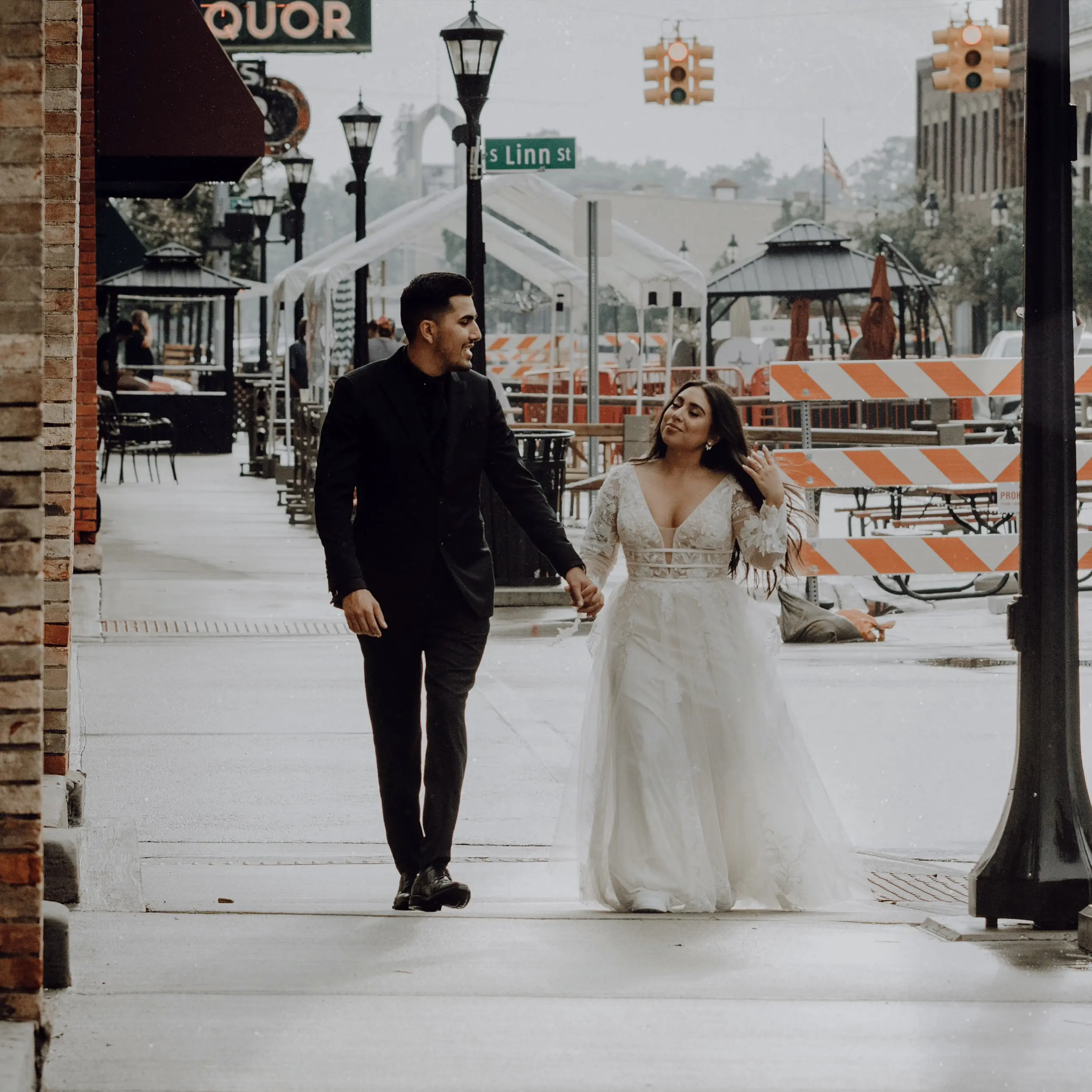Groom and Bride Wearing Lace Aline Wedding Dress Called Raelynn by Rebecca Ingram