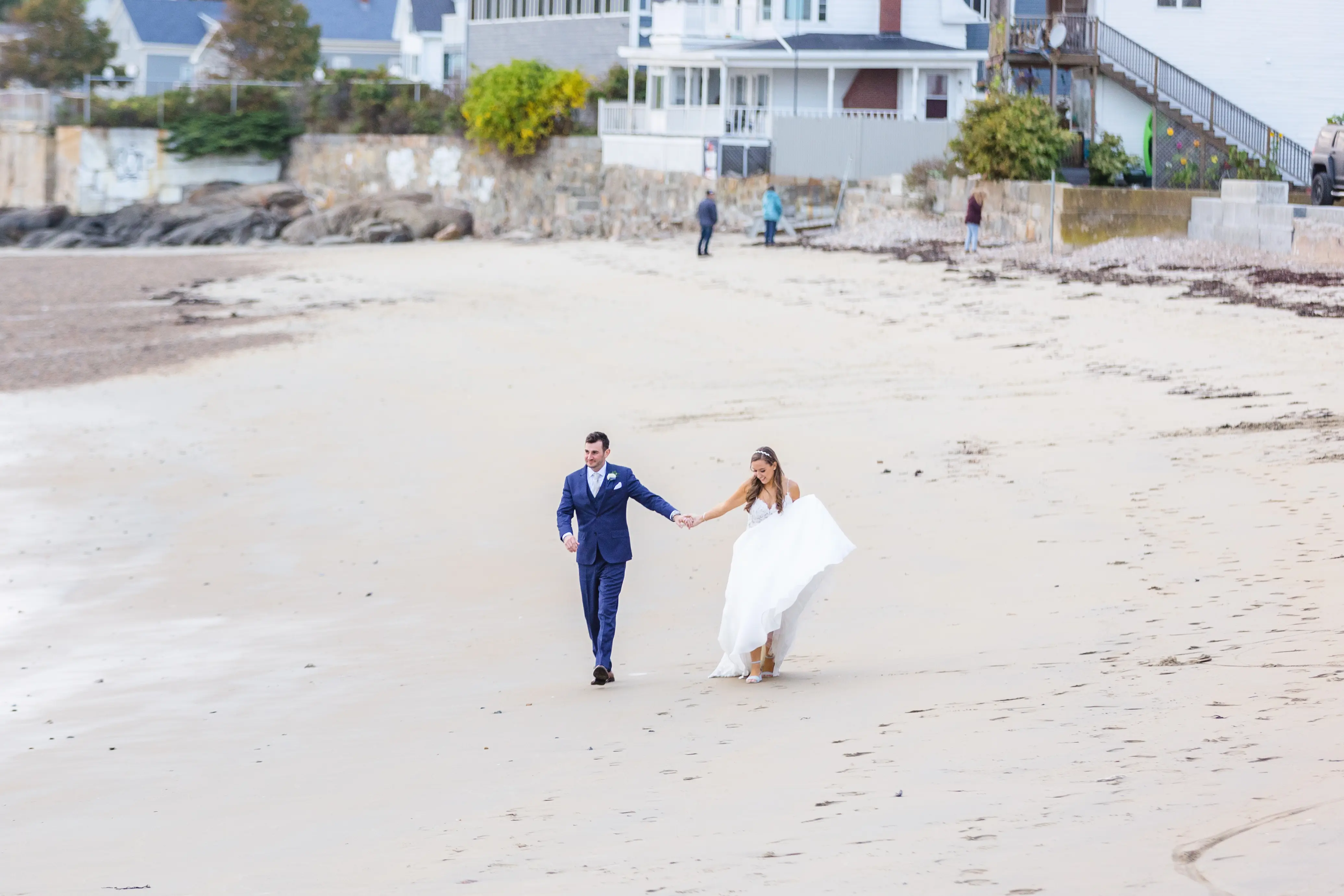 Groom on Beach with Bride in Flirty A-Line Wedding Dress with Beaded Lace Motifs and Sheer Bodice Called Savannah by Maggie Sottero