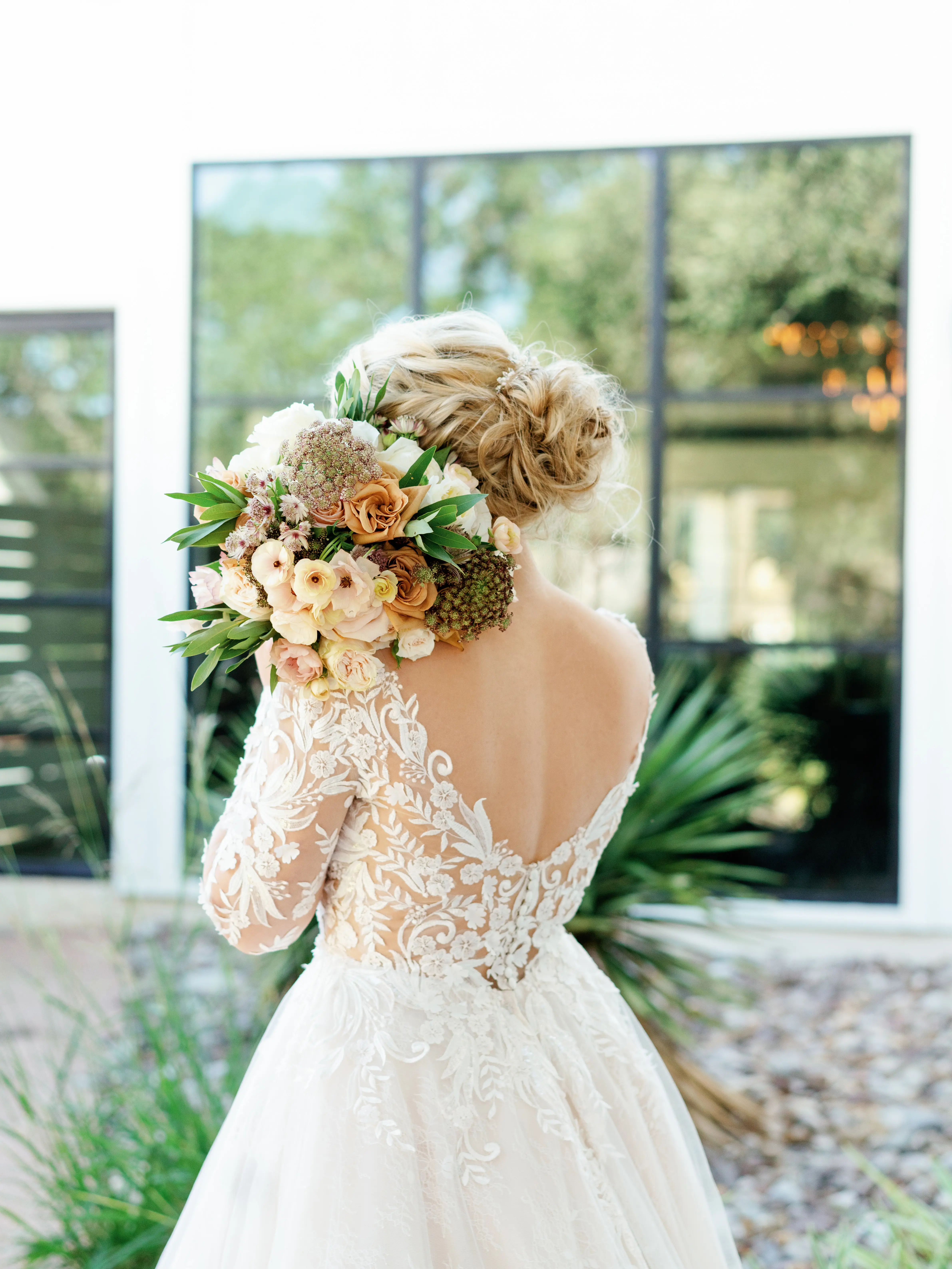Real Bride Wearing Lace Ballgown Wedding Dress Called Zander By Sottero and Midgley Holding A Beautiful Bouquet