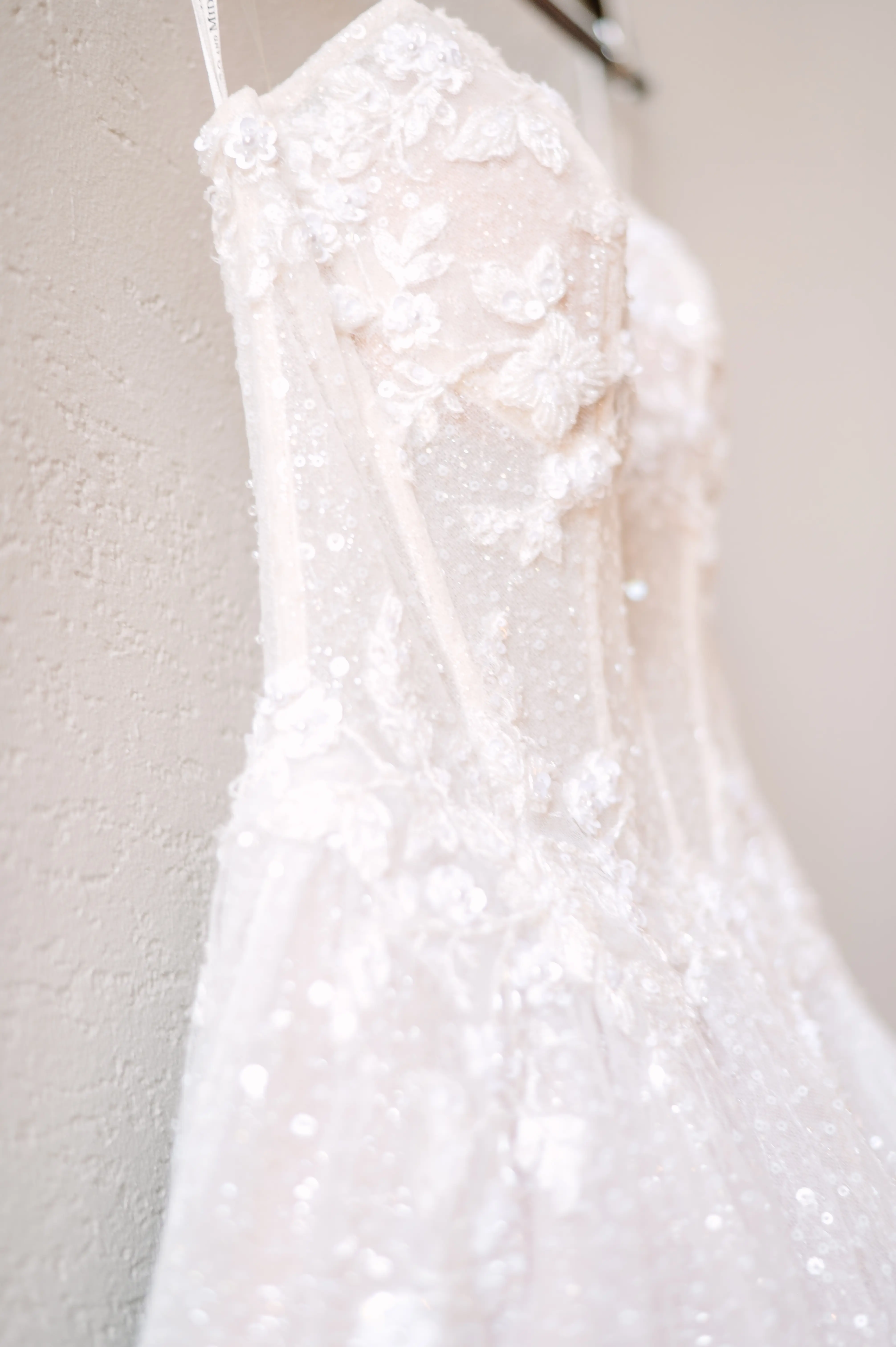 White Sparkle Wedding Dress Named Shasta By Sottero And Midgley On A Hanger
