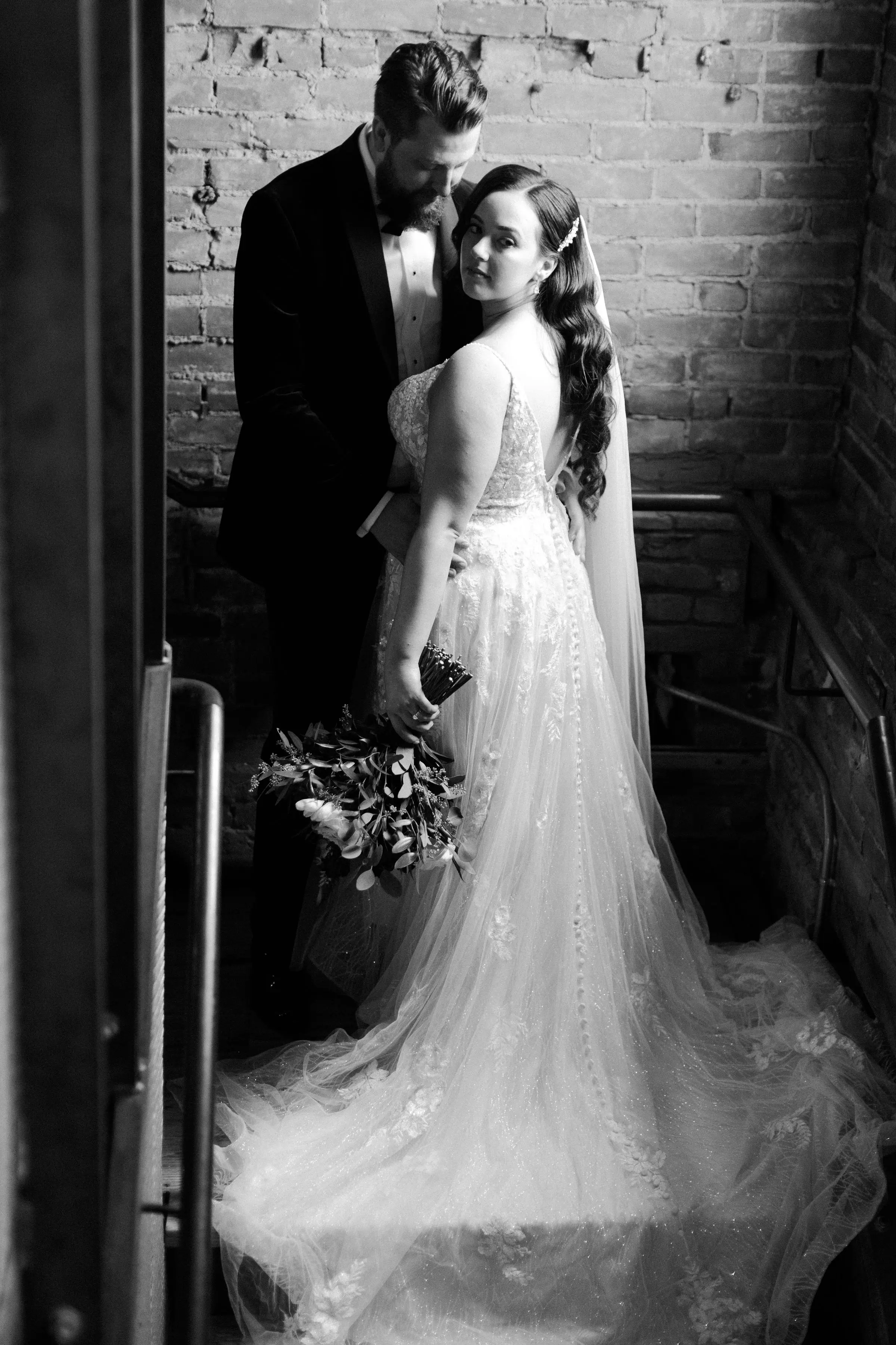 Bride Wearing Floral Lace Wedding Gown Called Laramie By Sottero And Midgley With Groom