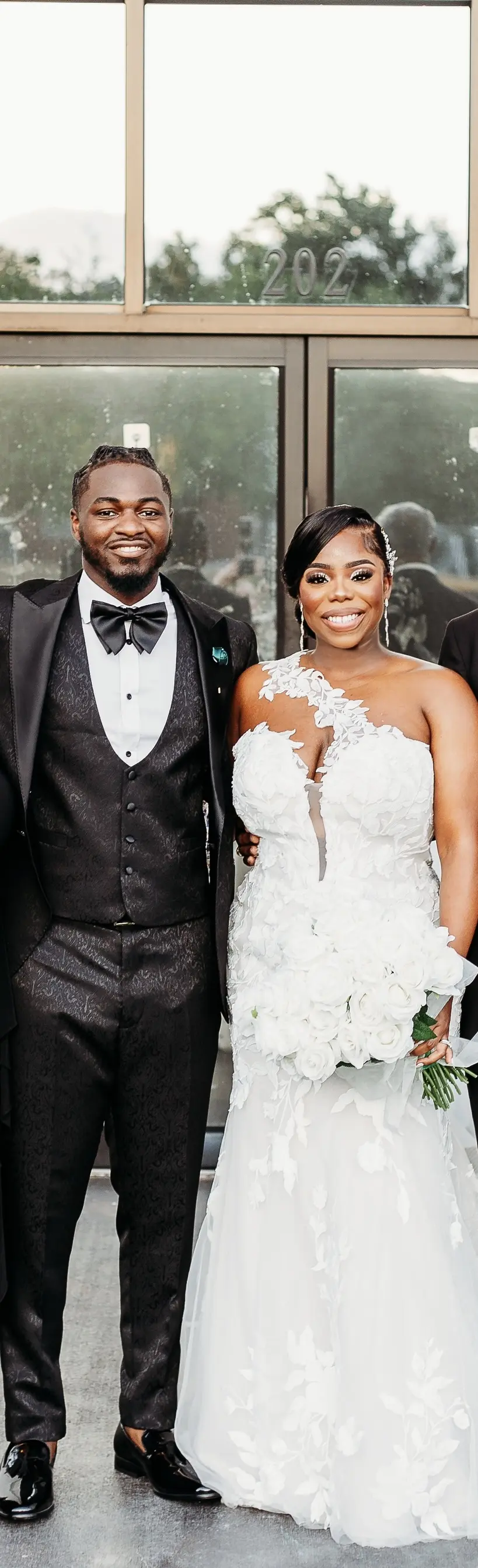 Bride wearing Hattie by Rebecca Ingram with her husband