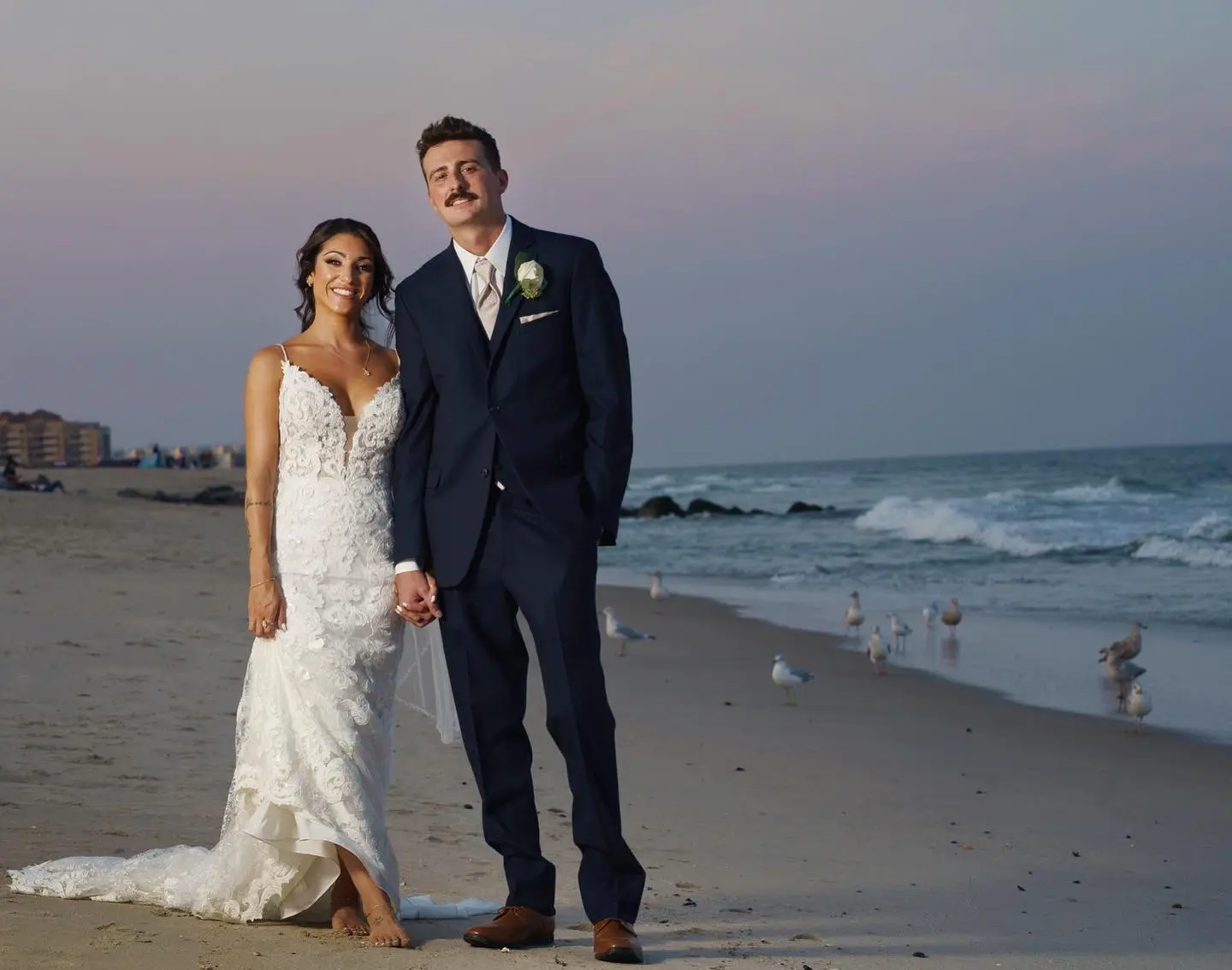 Groom with Bride at Beach Wedding wearing Sexy Boho Wedding Dress called Tuscany by Maggie Sottero.