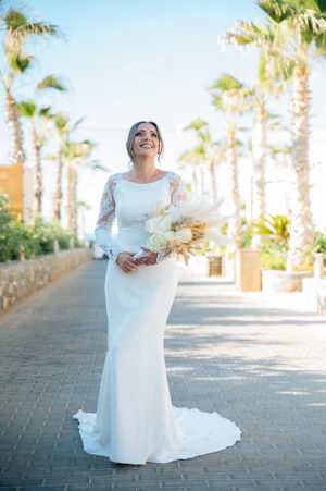Real Bride in Minimalist Crepe Long Sleeve Lace Sheath Wedding Dress Called Bethany by Rebecca Ingram