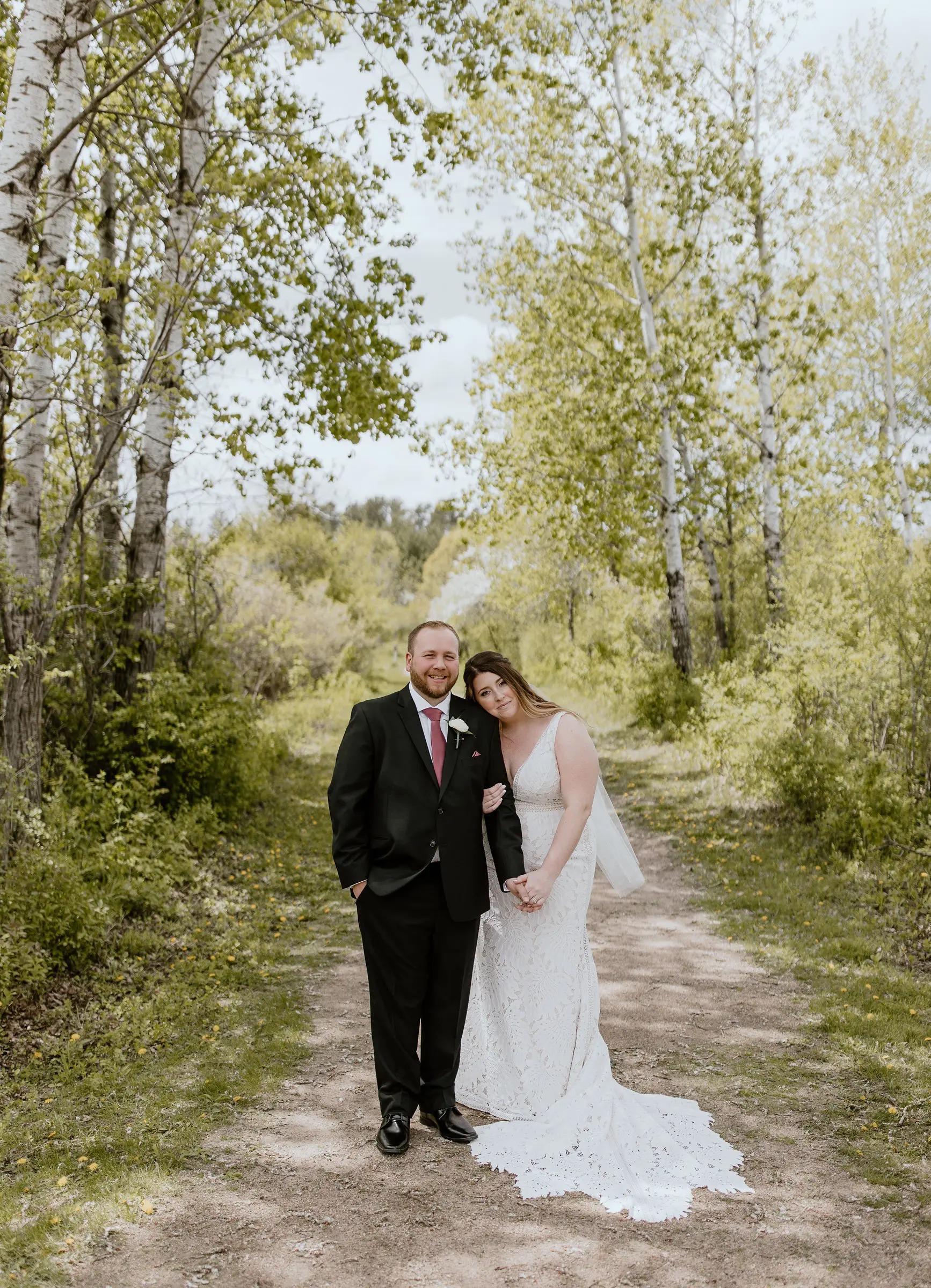 Groom with Bride in Boho Lace Wedding Dress with Oversized Florals Called Burke by Maggie Sottero
