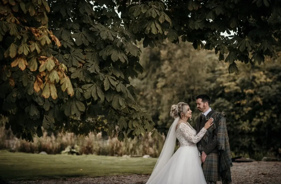 Groom With Bride Wearing Long Sleeved Ball Gown Mallory Dawn By Maggie Sottero