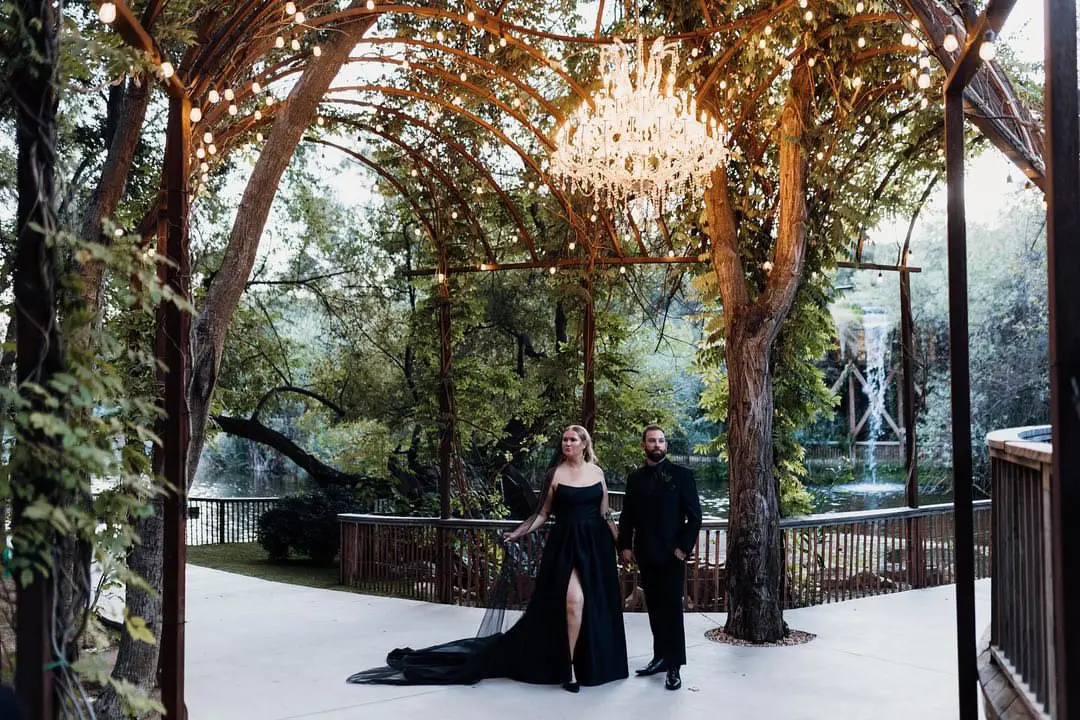 Bride wearing Aspen wedding dress by Sottero and Midgley with her husband