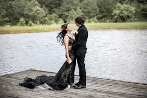 Bride wearing Zander Lane by Sottero and Midgley on a dock with her husband