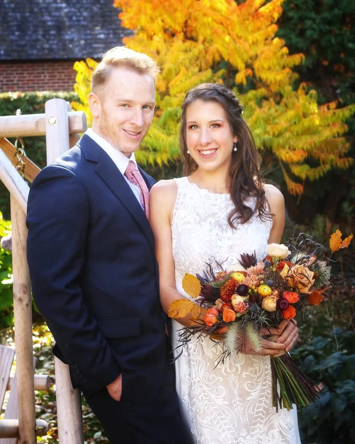 Real Bride in Halter Fit-and-Flare Crepe Wedding Dress with Layers of Sheer Lace and Lace Motifs Called Kevyn by Sottero & Midgley