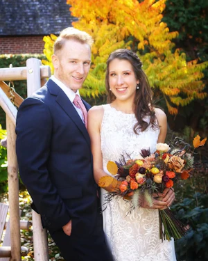 Real Bride in Halter Fit-and-Flare Crepe Wedding Dress with Layers of Sheer Lace and Lace Motifs Called Kevyn by Sottero & Midgley