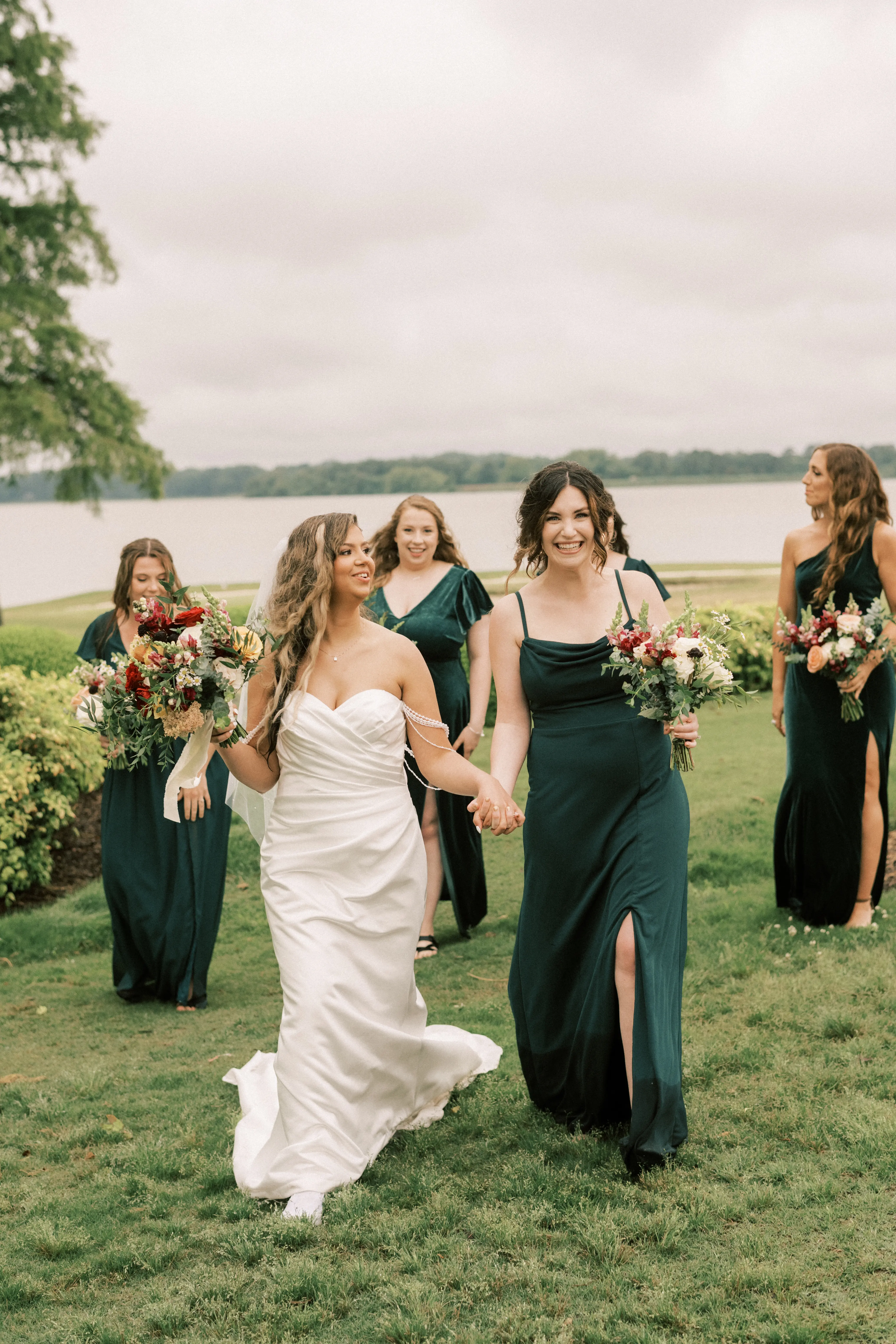 Bride wearing Clover by Rebecca Ingram walking with her bridesmaids
