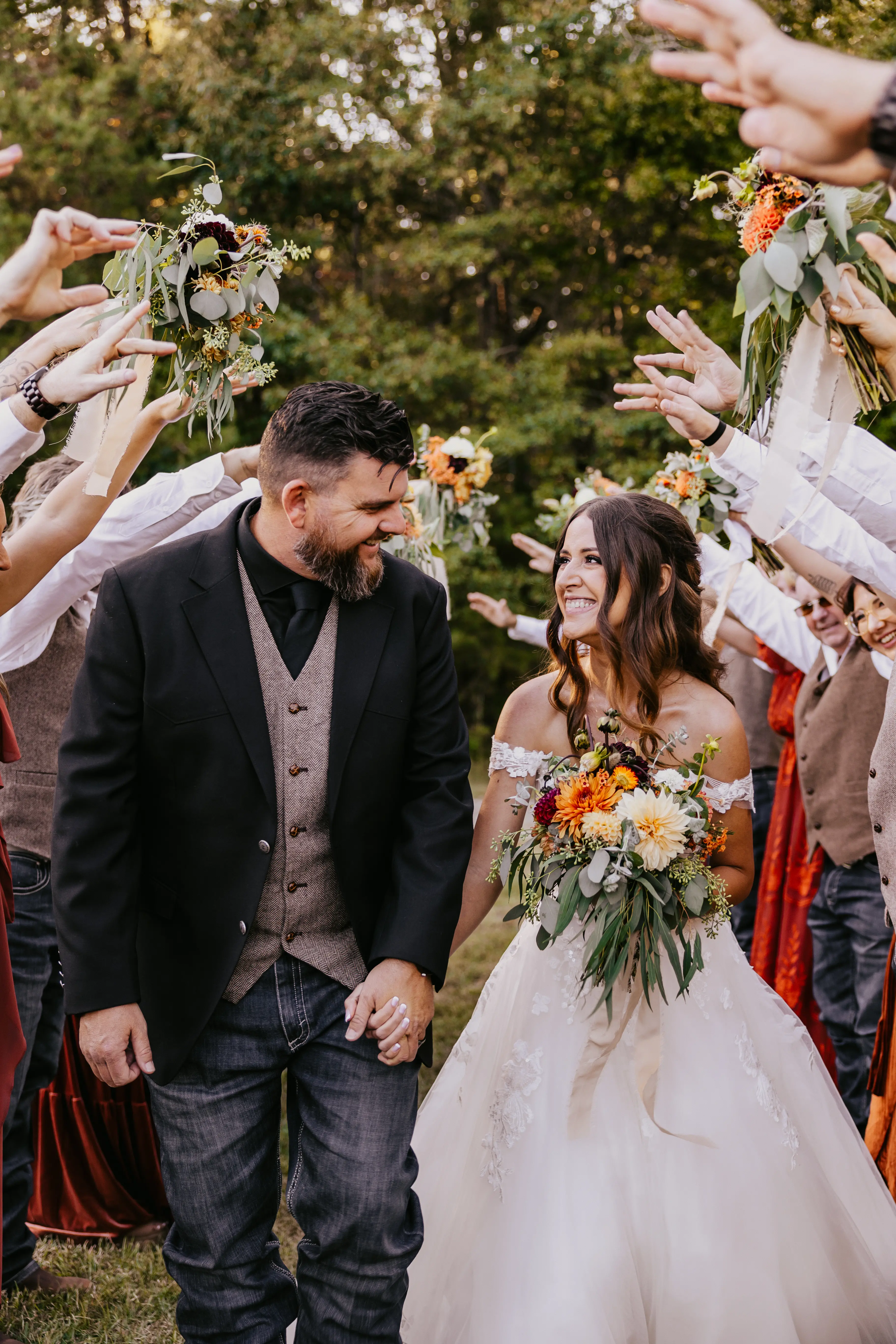 Bride wearing Harlem wedding dress by Maggie Sottero with her husband