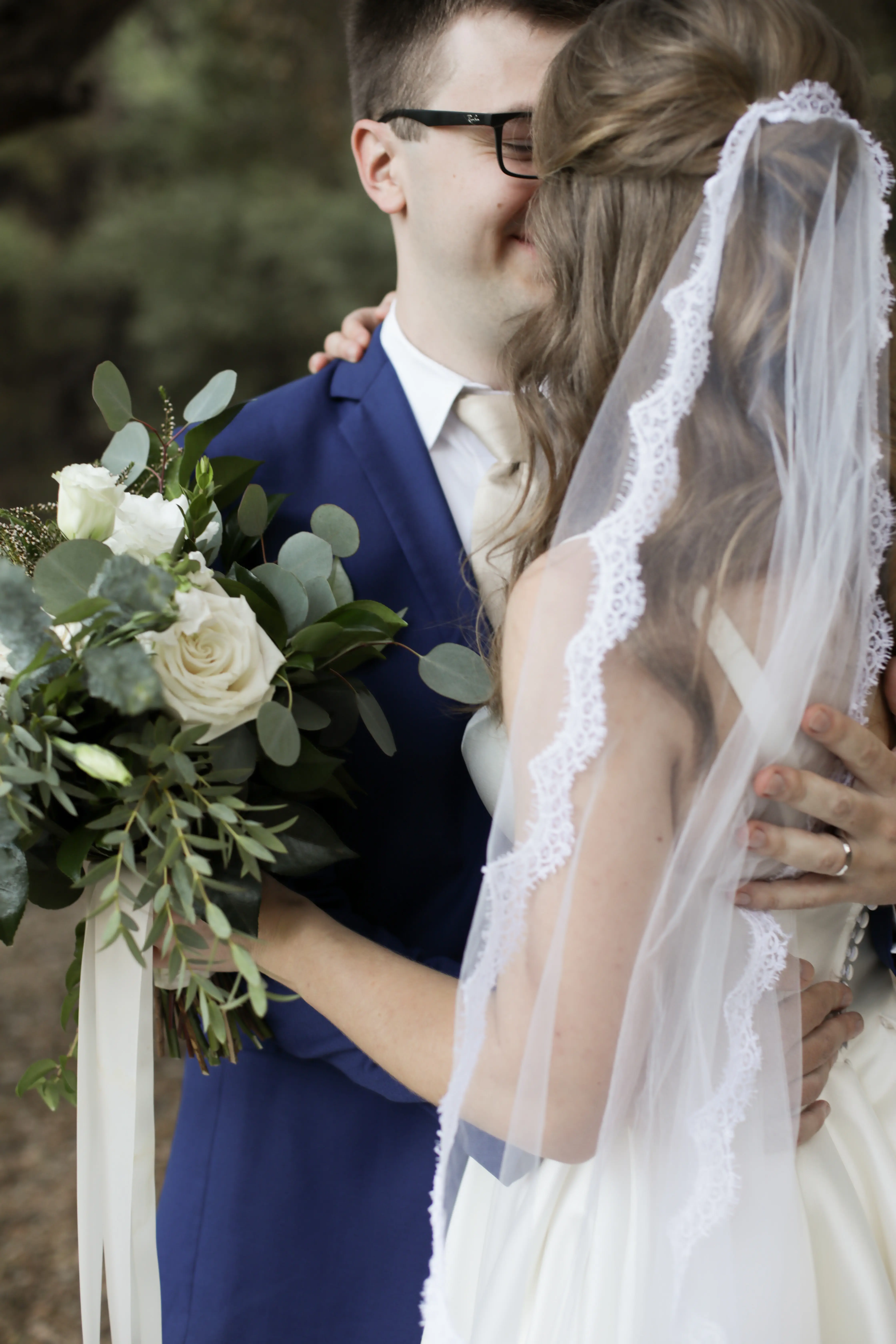 Groom holding Bride wearing Simple Ballgown Wedding Dress called Selena by Maggie Sottero