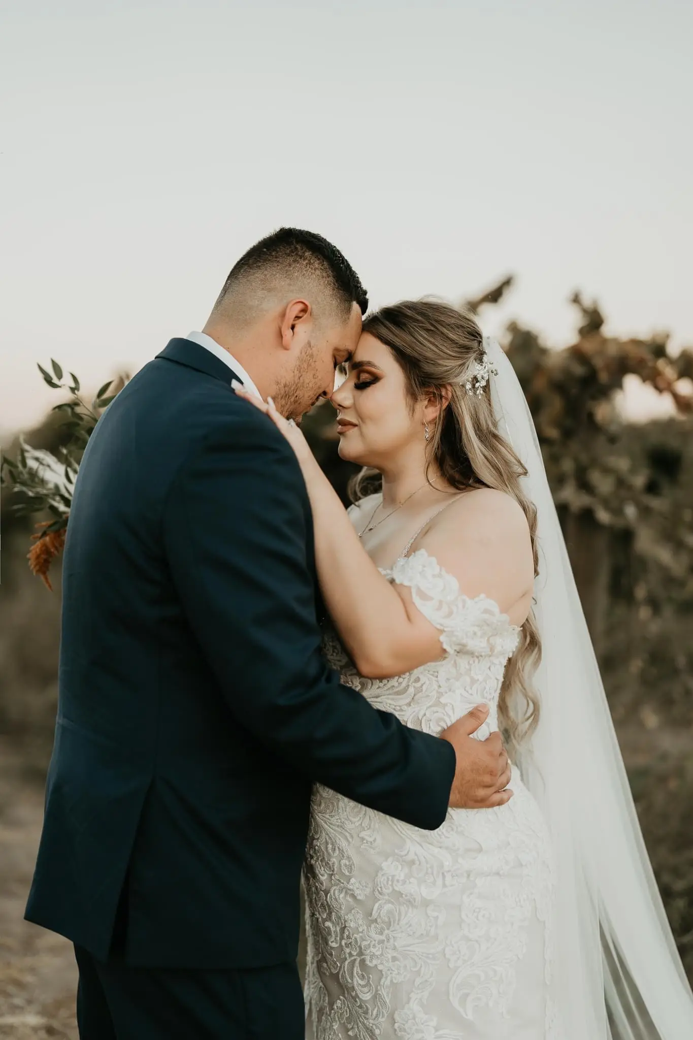 Groom With Bride In Lacey Off The Shoulder Wedding Dress Named Fiona By Maggie Sottero