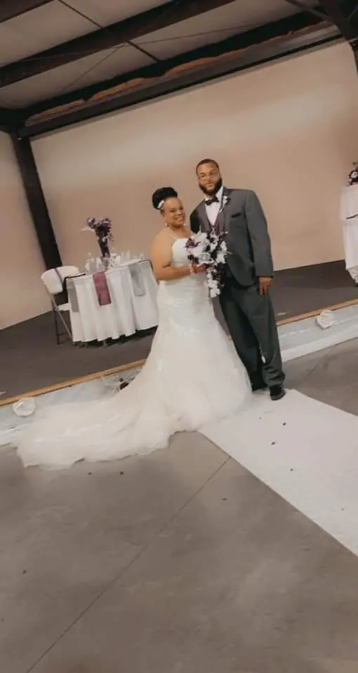 Groom With Bride Wearing Lace Mermaid Style Dress Called Alistaire Lynette By Maggie Sottero