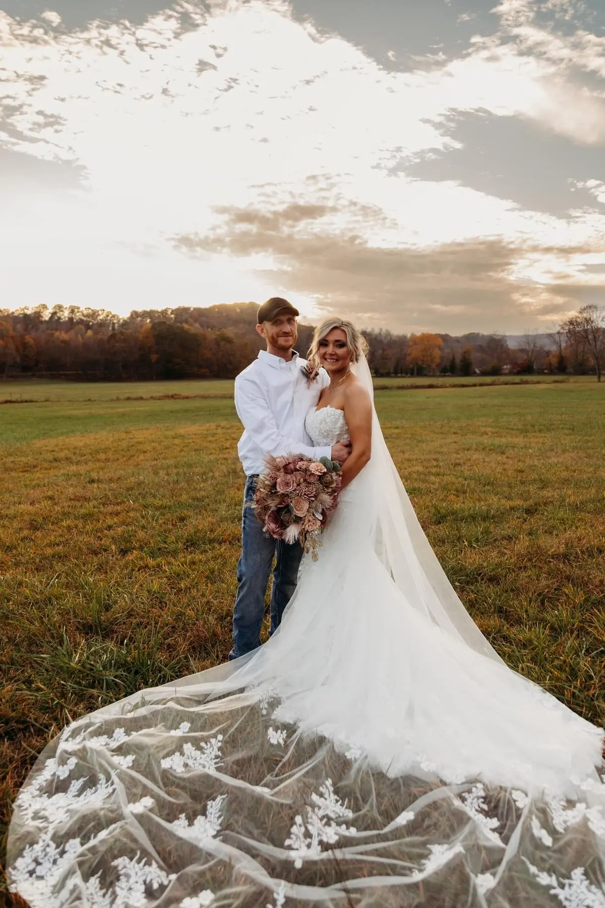 Bride wearing Lennon wedding dress by Maggie Sottero hugging her husband