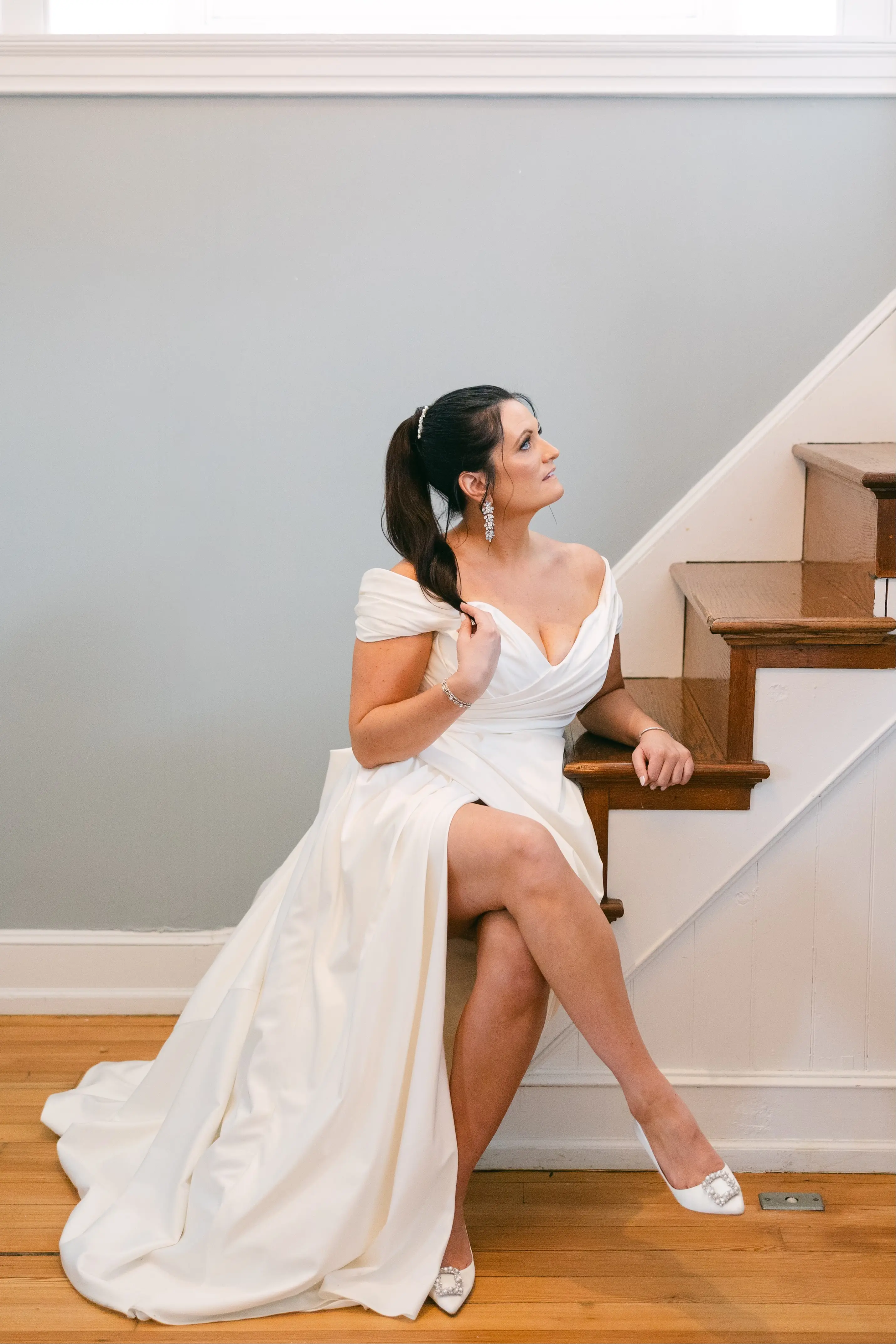 Bride wearing Ekaterina by Maggie Sottero sitting on the stairs