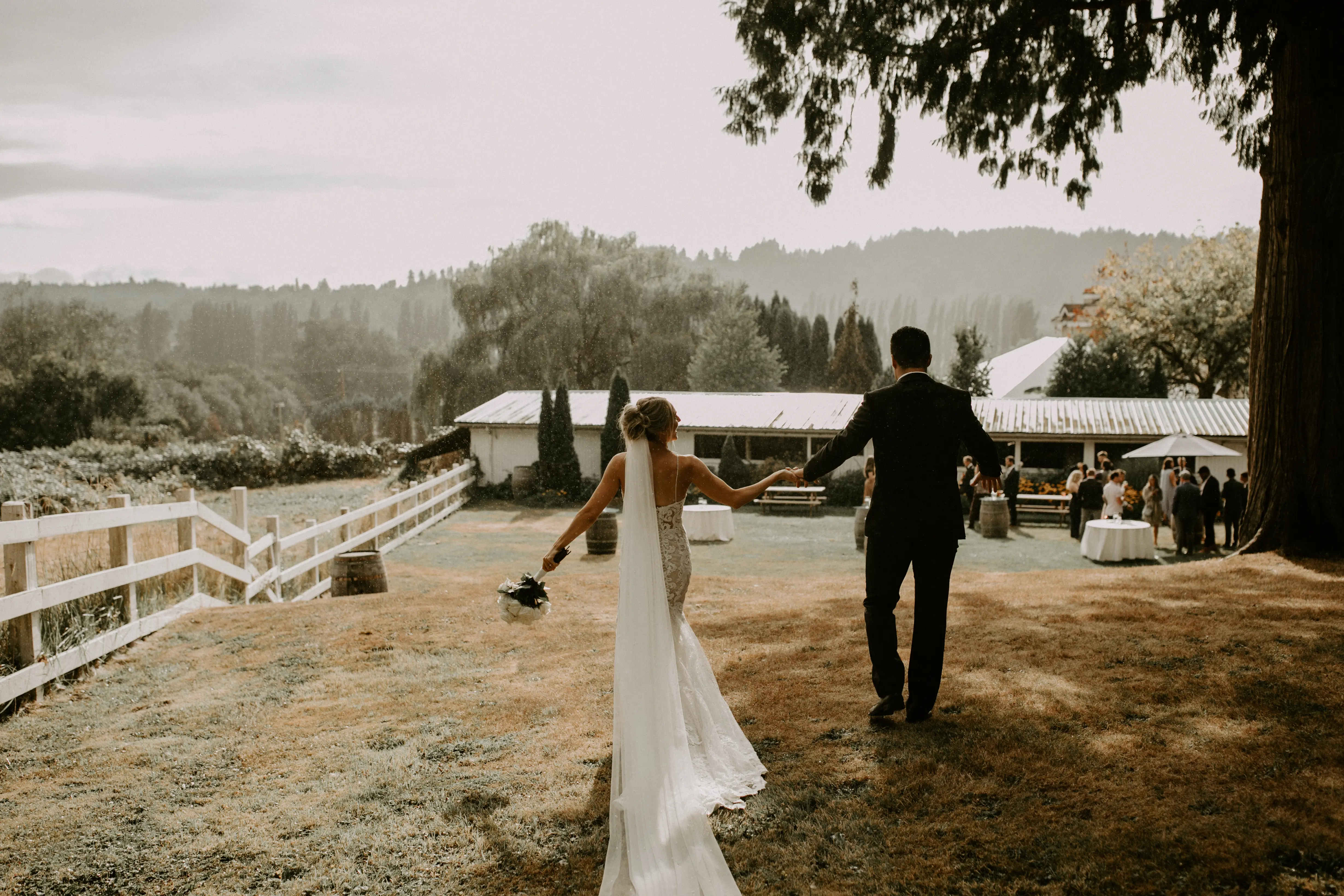 Bride with groom wearing romantic lace sheath wedding dress