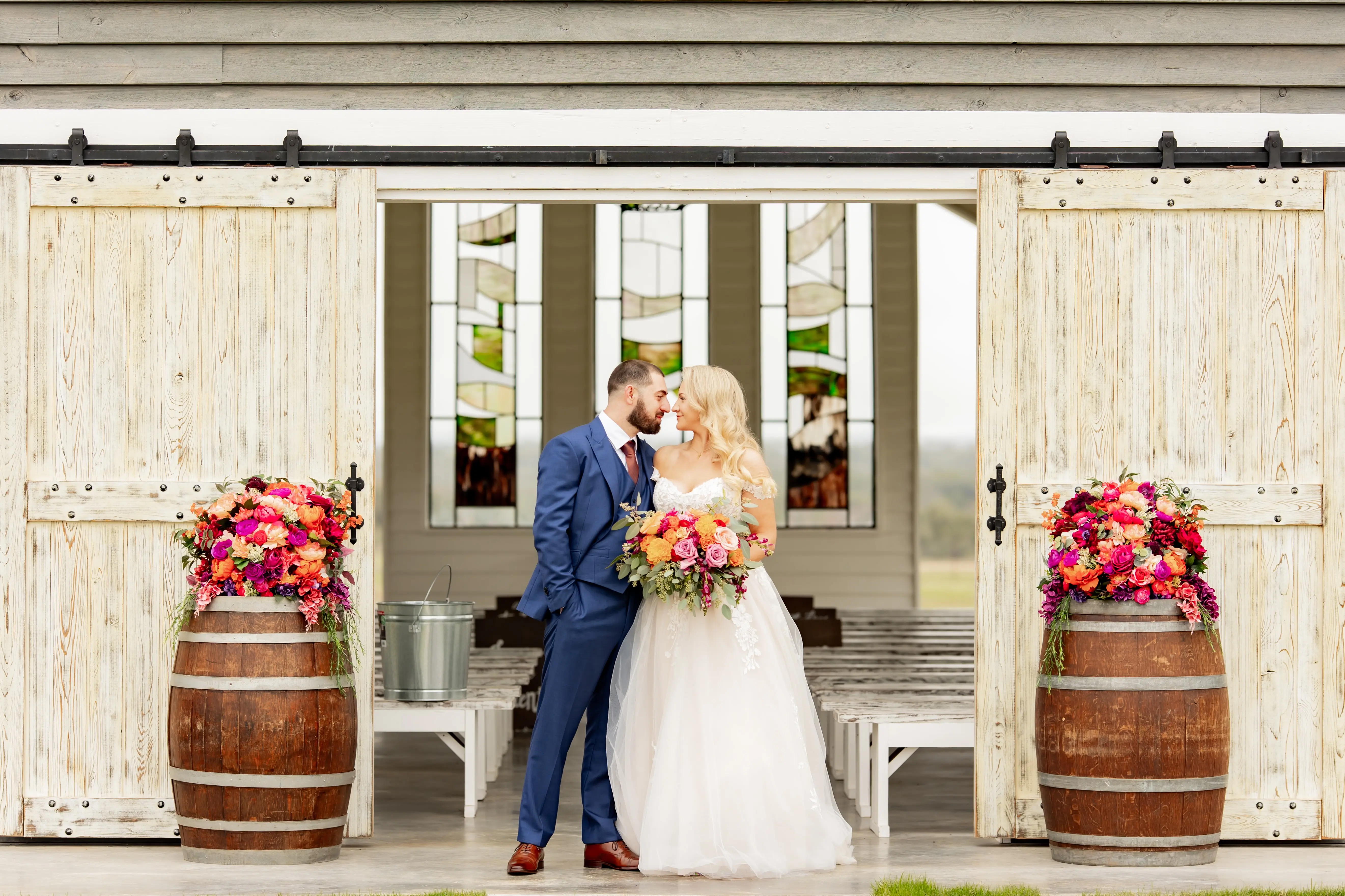Bride wearing Harlem by Maggie Sottero with her husband