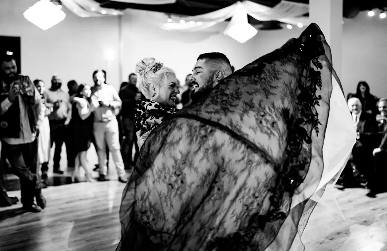 Bride Wearing Black Lace Wedding Dress Called Zander By Sottero And Midgley Dancing With Groom