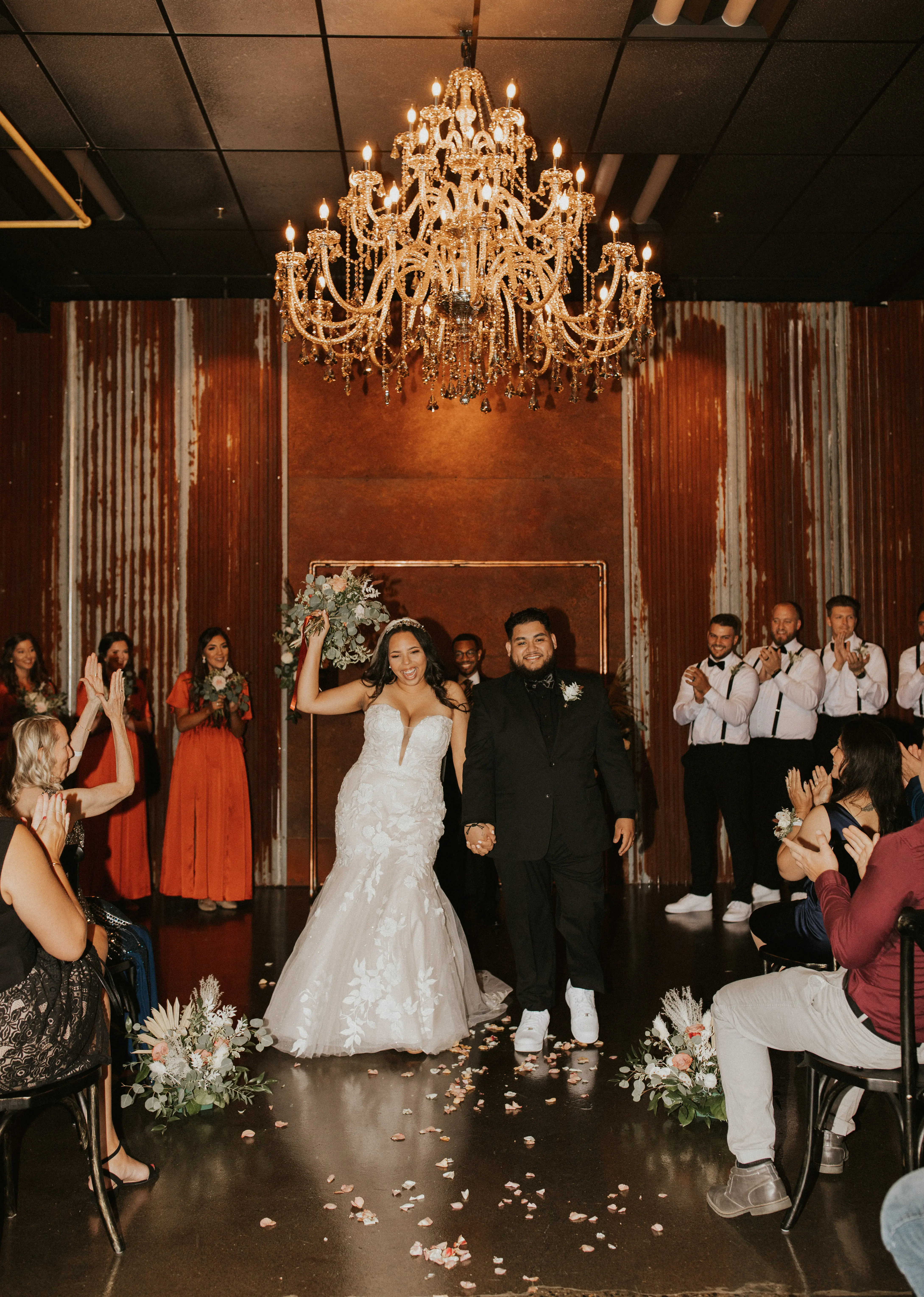 Bride and Groom Holding Hands Wearing Wedding Gown Called Hattie by Rebecca Ingram