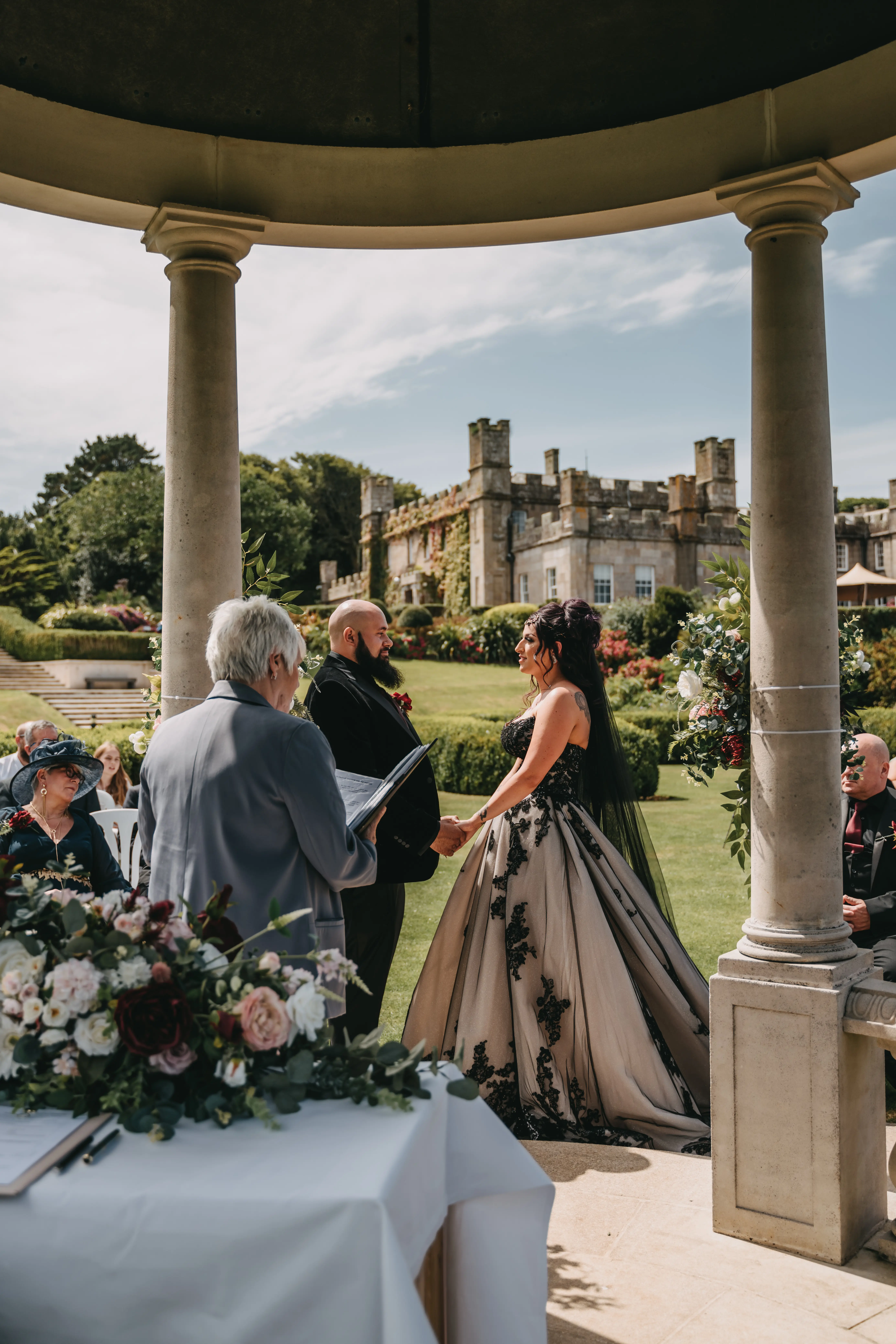 Bride wearing Norvinia by Sottero and Midgley being married to her husband