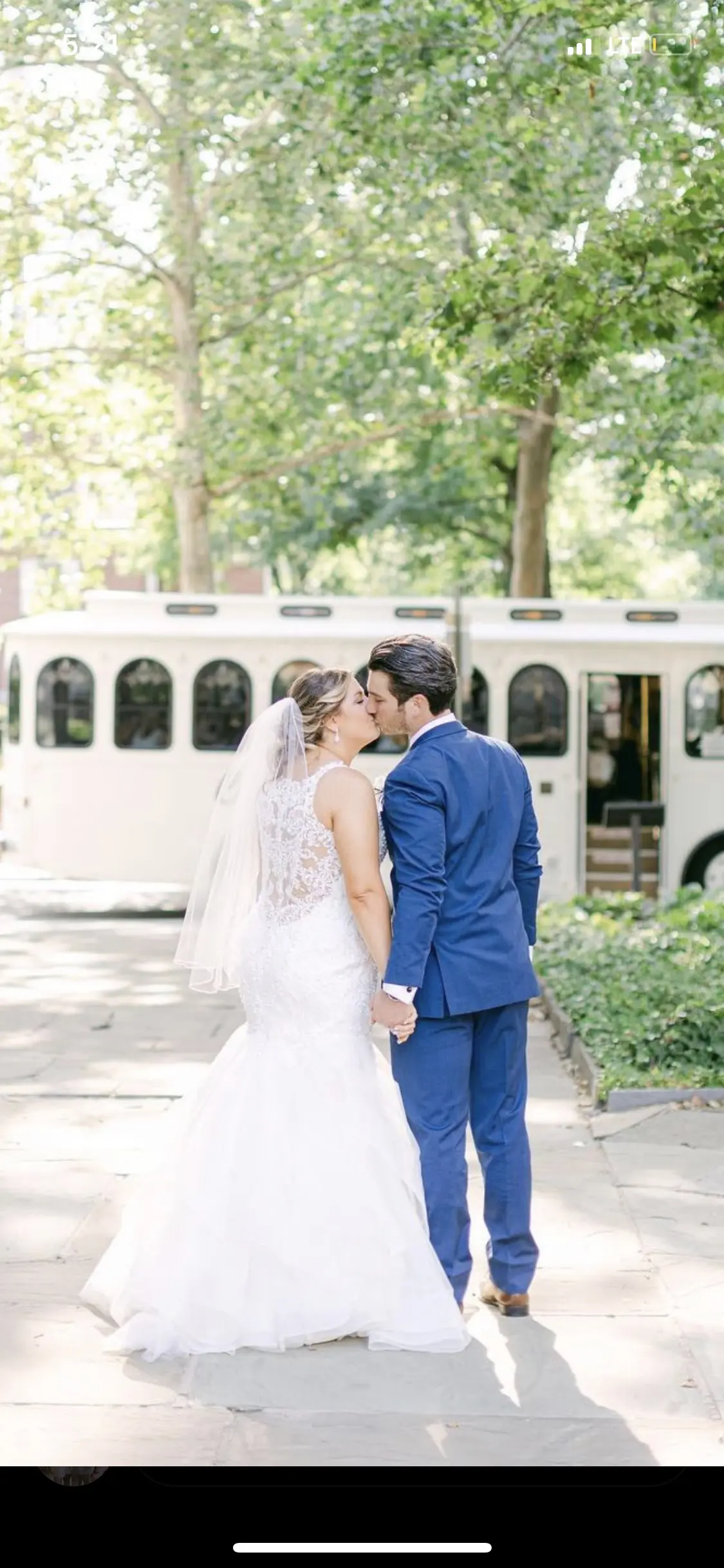 bride with groom wearing organza mermaid wedding dress