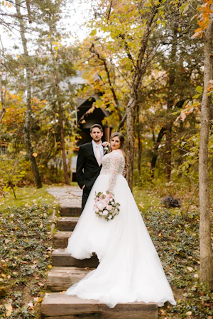Bride Wearing Princess Wedding Dress Called Mallory Dawn By Maggie Sottero With Groom On Wooden Steps
