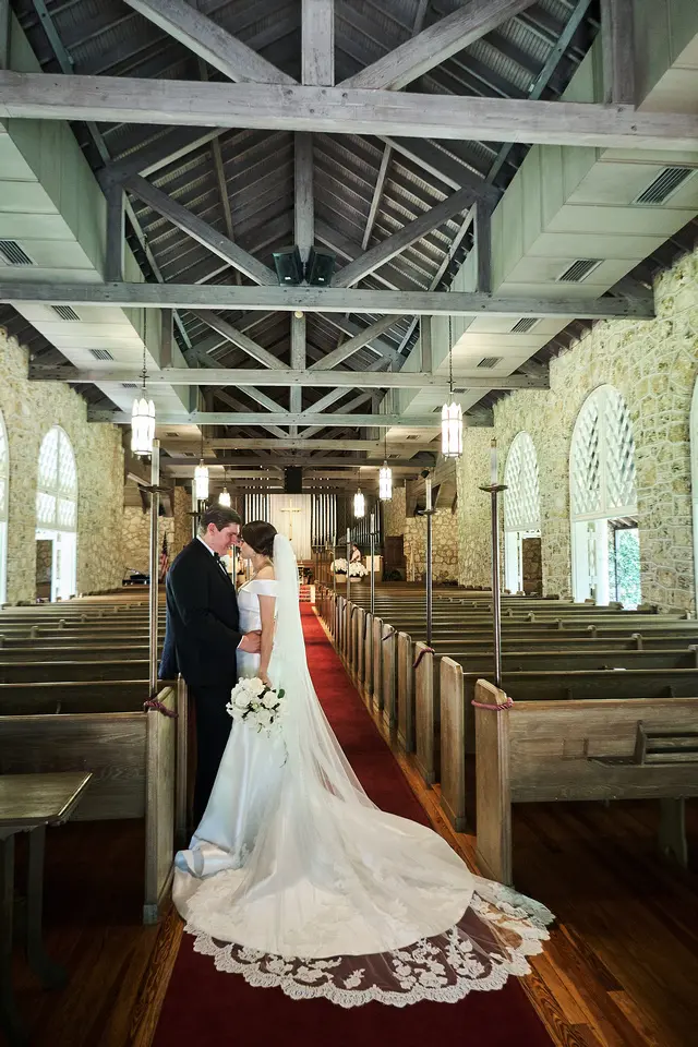 bride with groom in off the shoulder elegant wedding dress