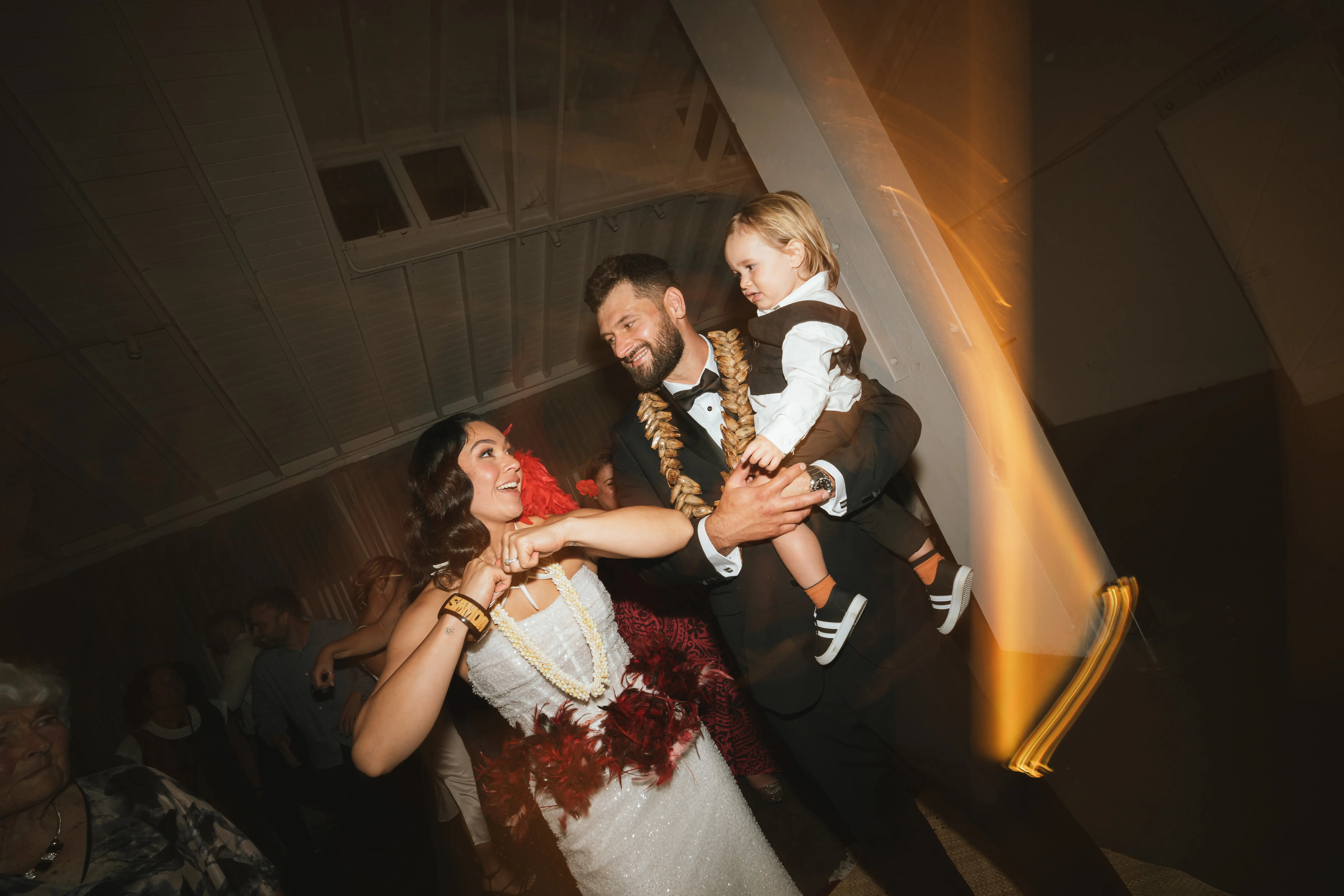 Bride wearing Drew by Maggie Sottero dancing with her family