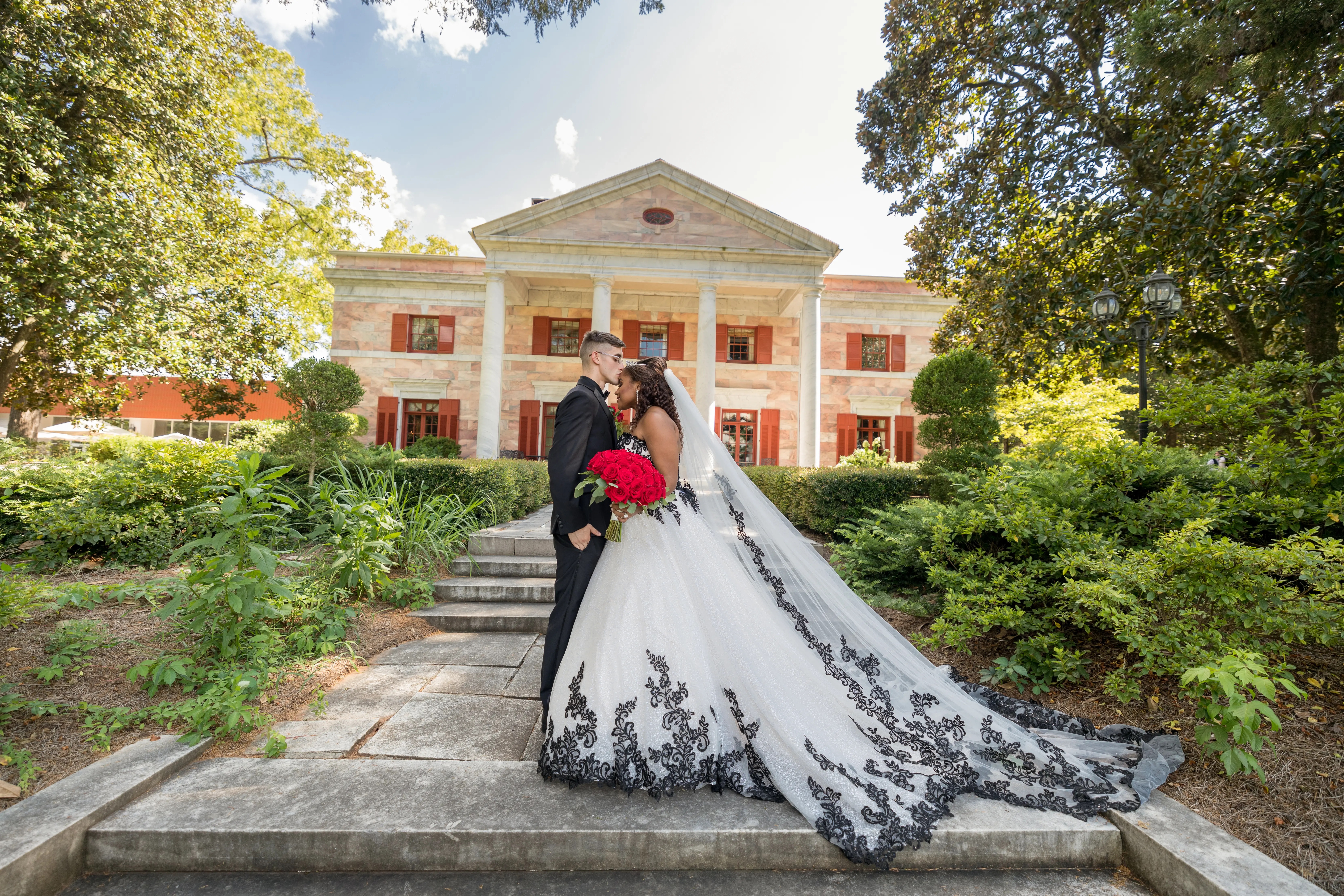 Groom With Bride Wearing Ball Gown With Black Lace Tristyn By Maggie Sottero