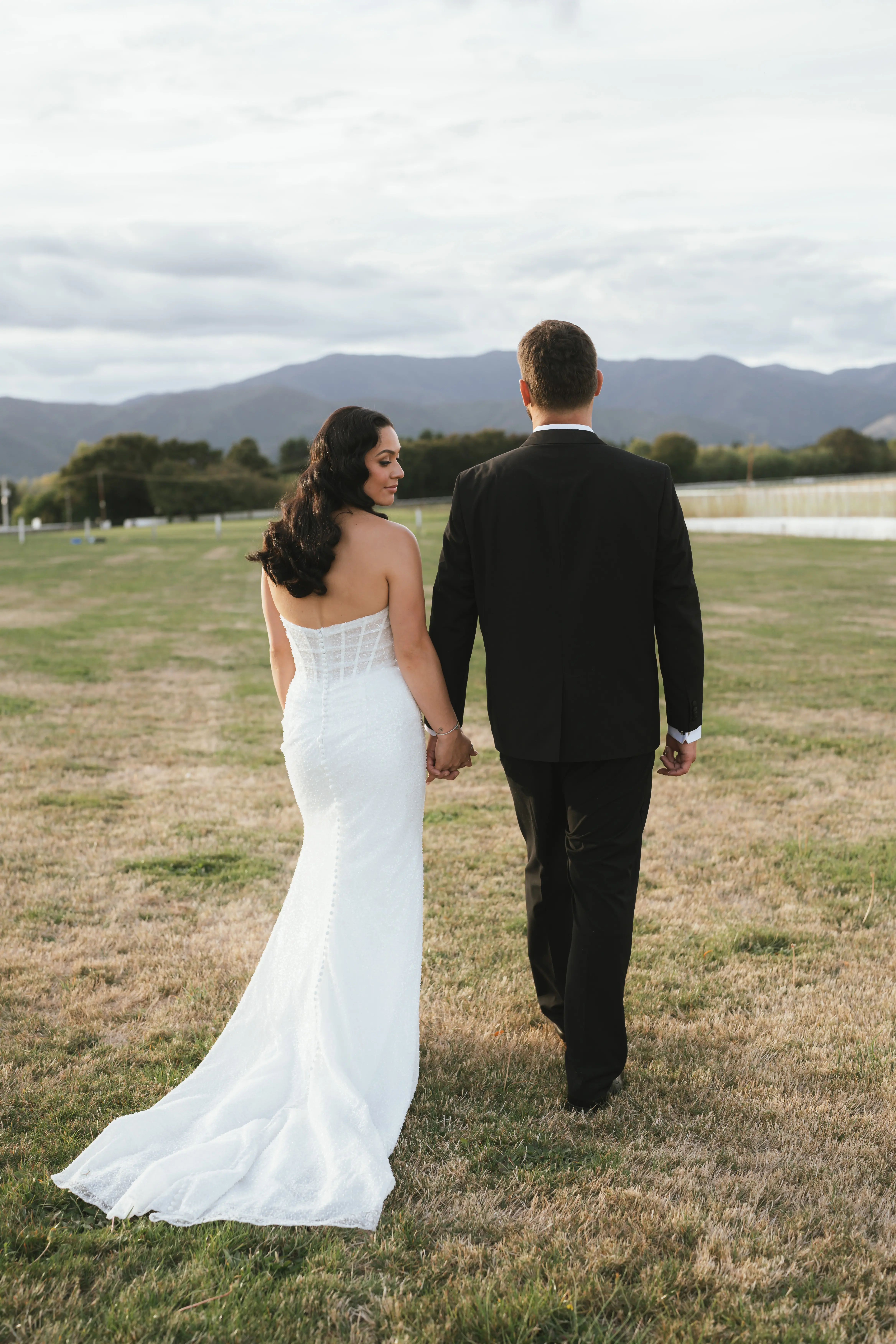 Bride wearing Drew by Maggie Sottero and her husband