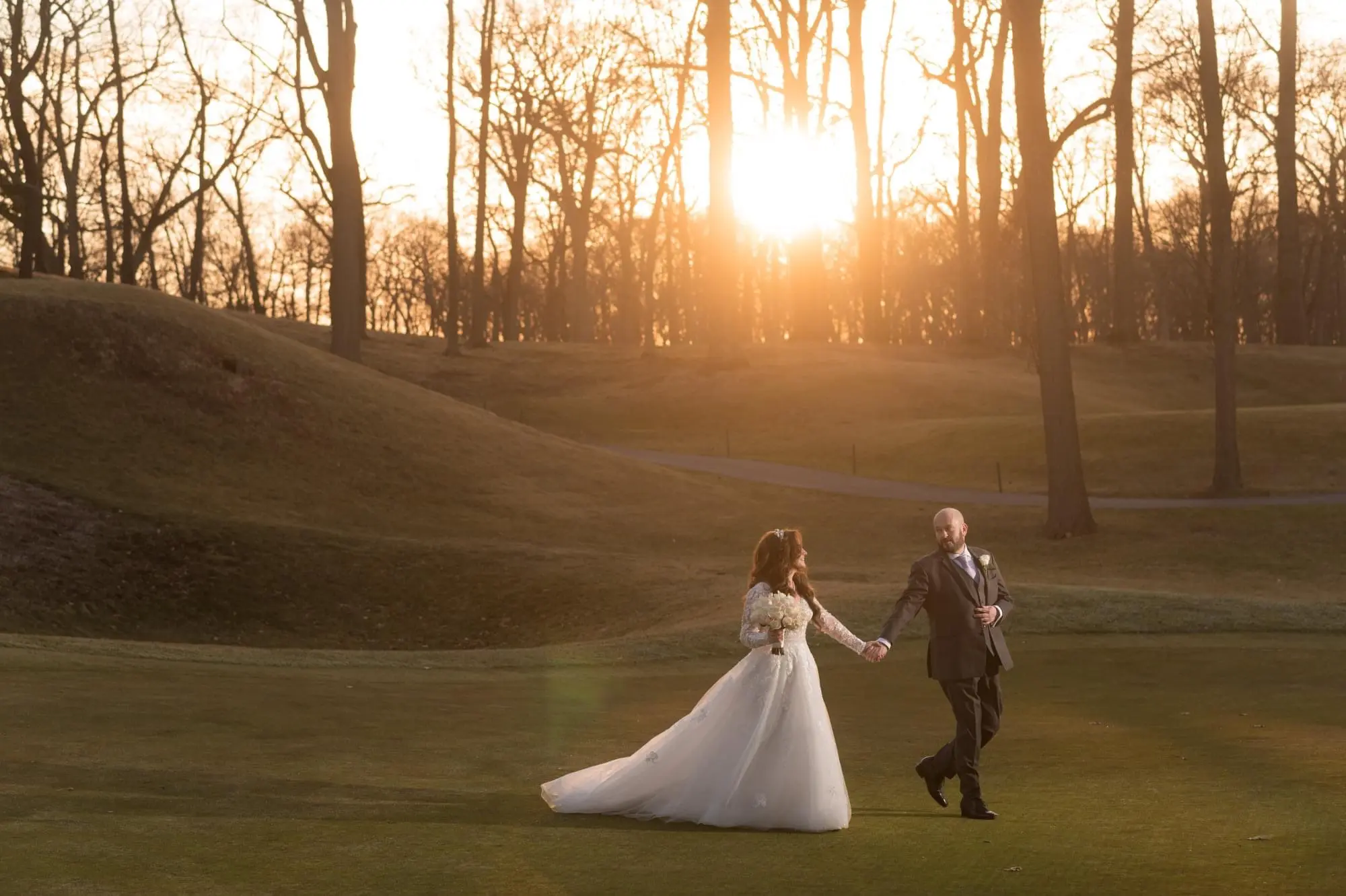 Groom Holding Hands with Bride in Illusion Sleeve A-Line Wedding Dress Inspired by Vintage Royalty called Raphael by Maggie Sottero