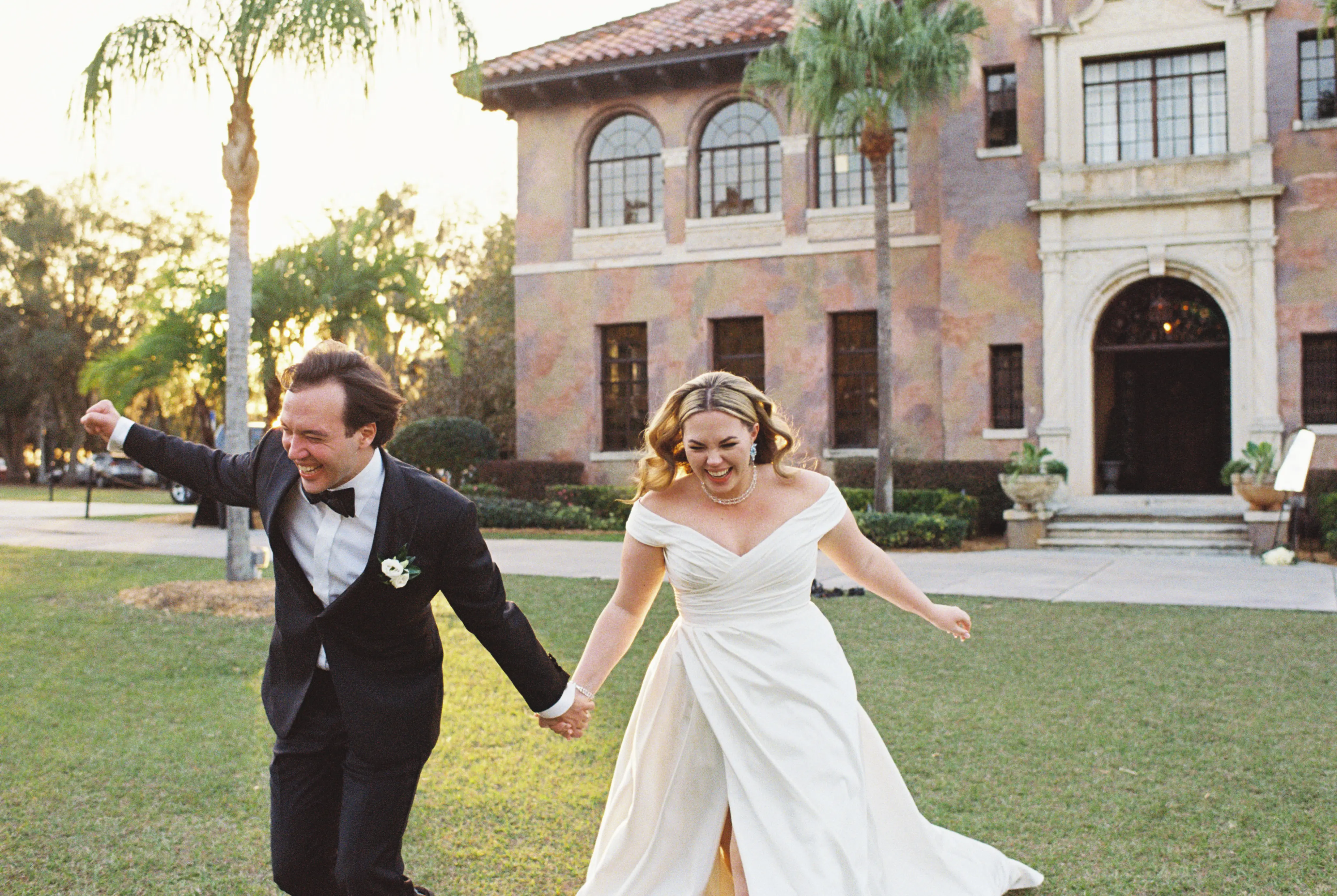 Bride wearing Ekaterina by Maggie Sottero running with the groom