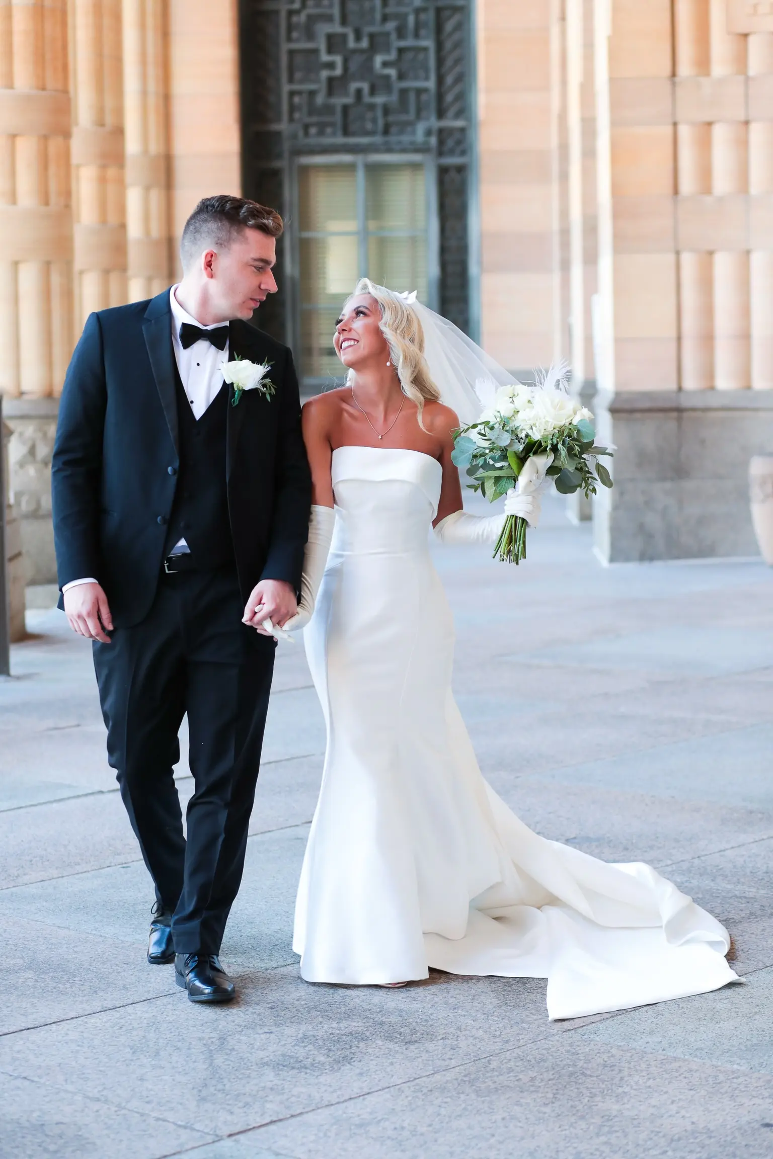 Bride In Simple Satin Wedding Dress With Gloves Called Mitchell By Maggie Sottero